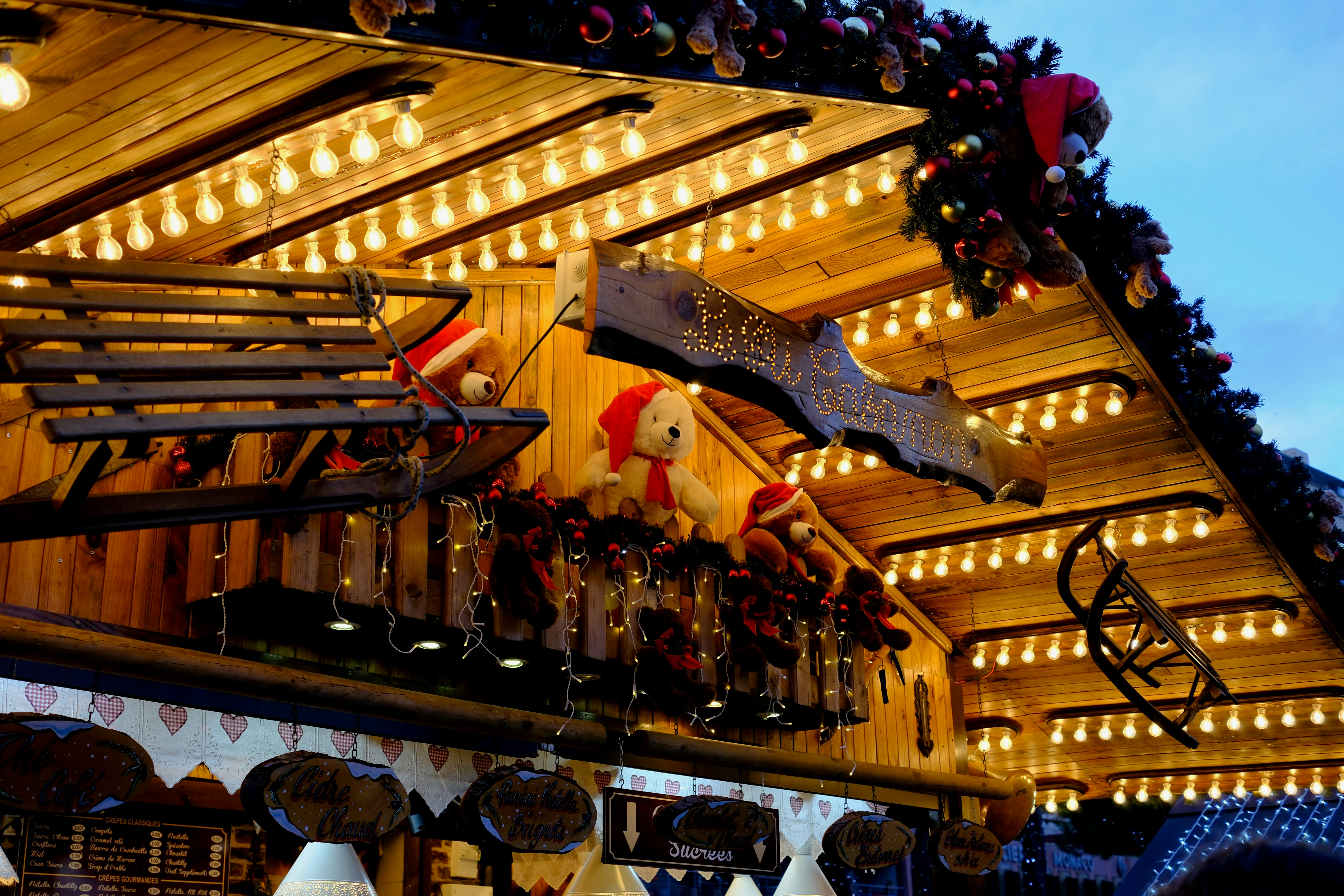 Wooden stall decorated with lights and teddy bears