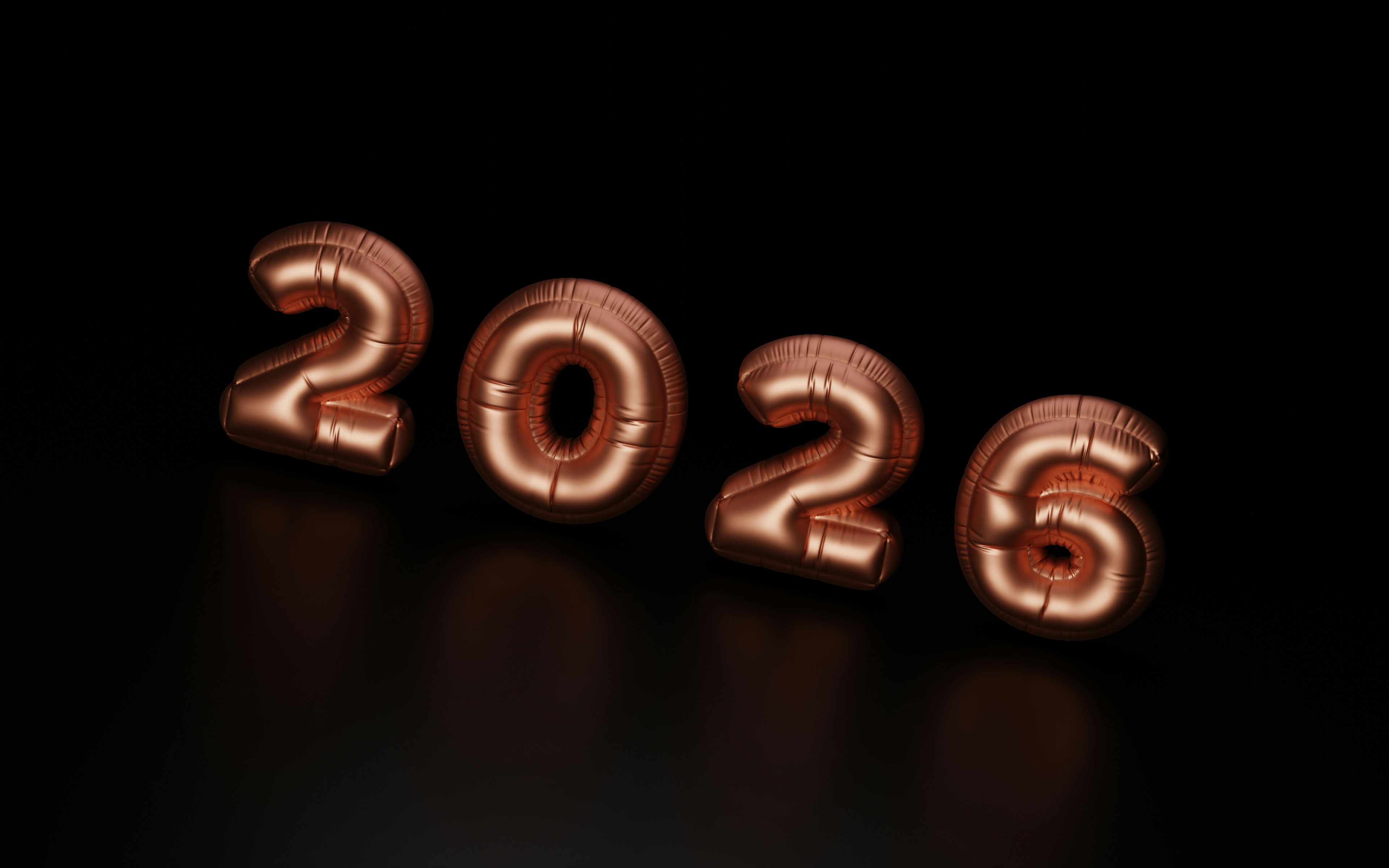 Rose gold balloons spelling out 2026