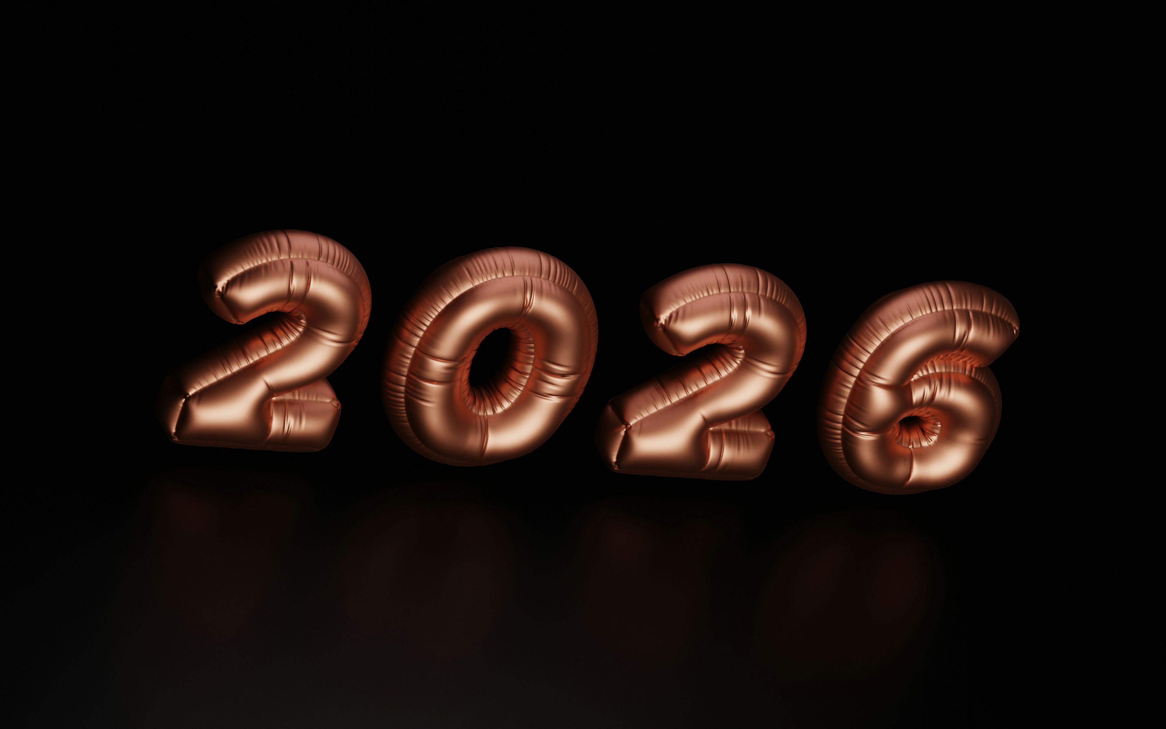 Rose gold balloons spelling out 2026