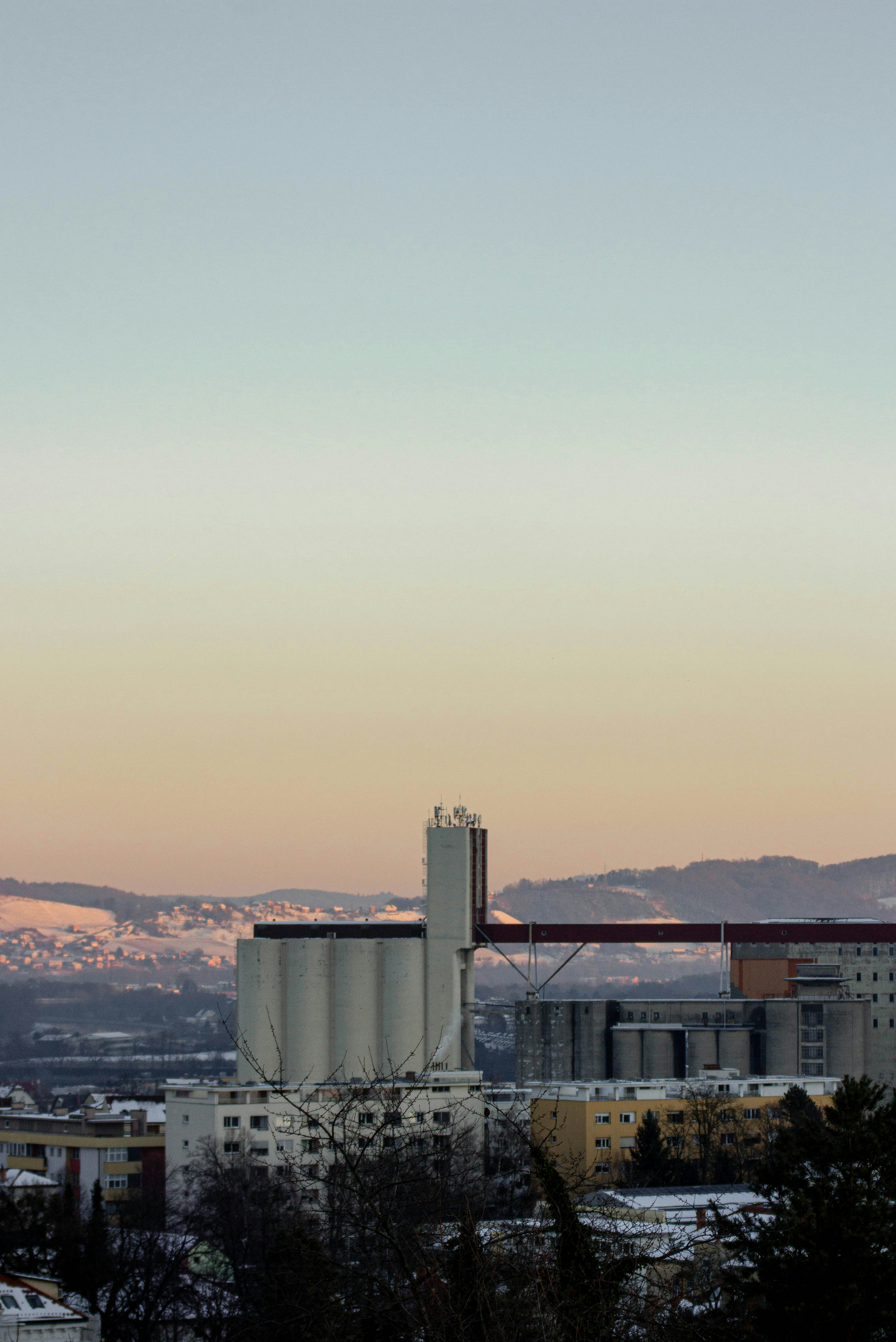 Industrial buildings against a soft sky