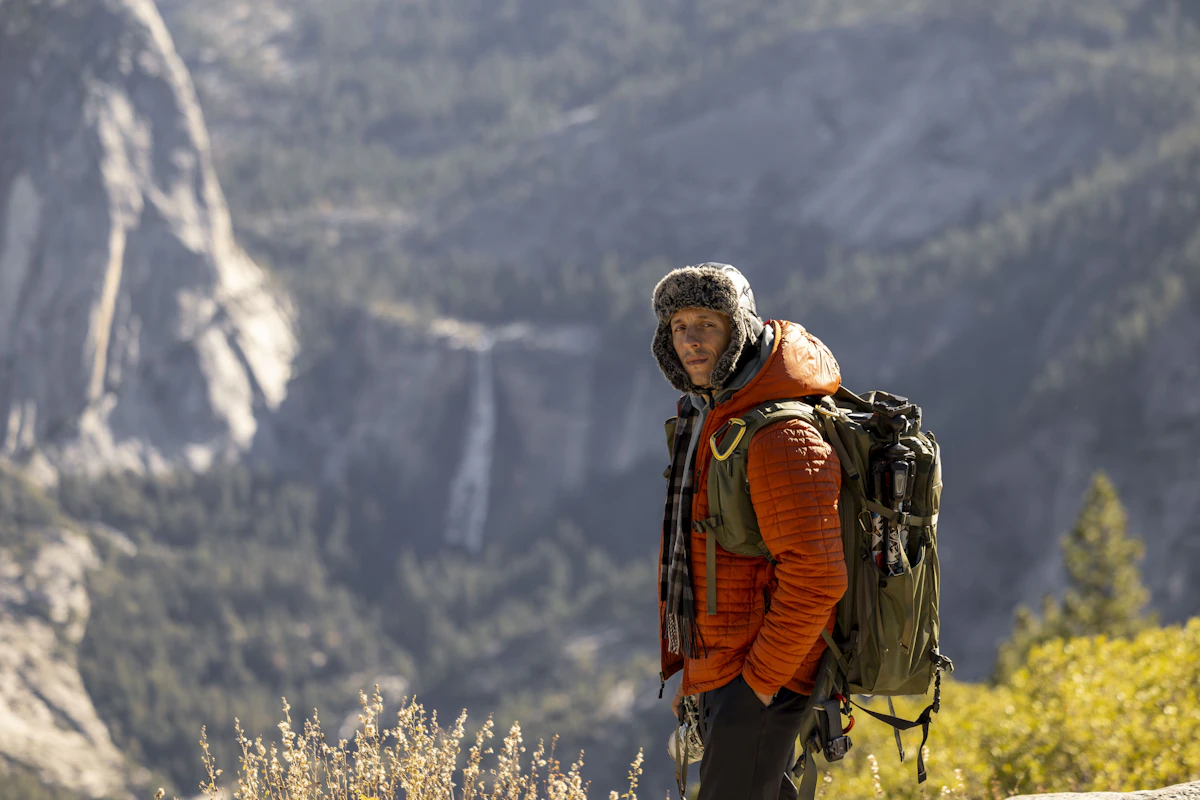 Man with backpack in a mountainous landscape