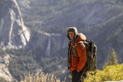 Man with backpack in a mountainous landscape