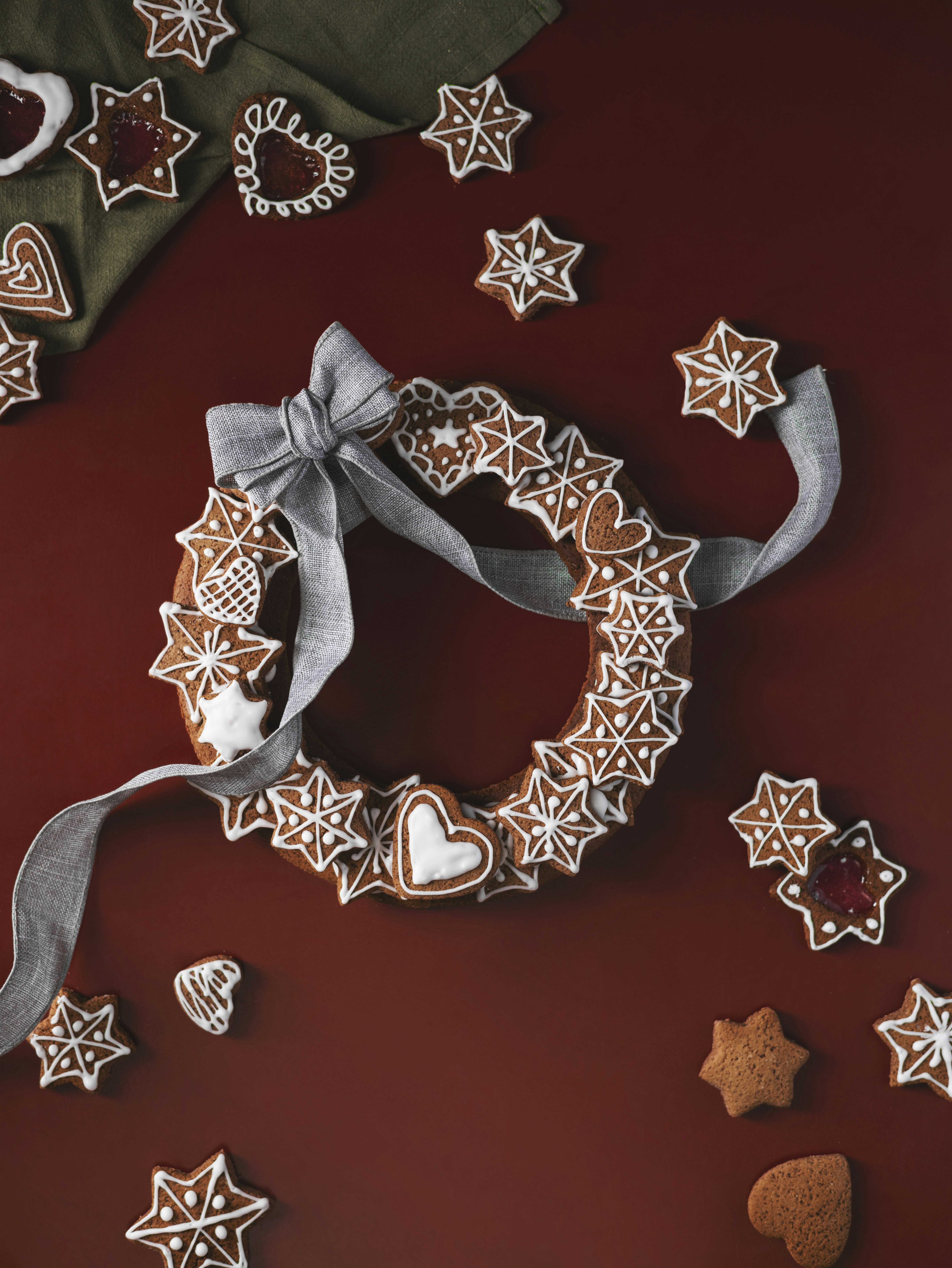Gingerbread cookies arranged in a wreath with a ribbon