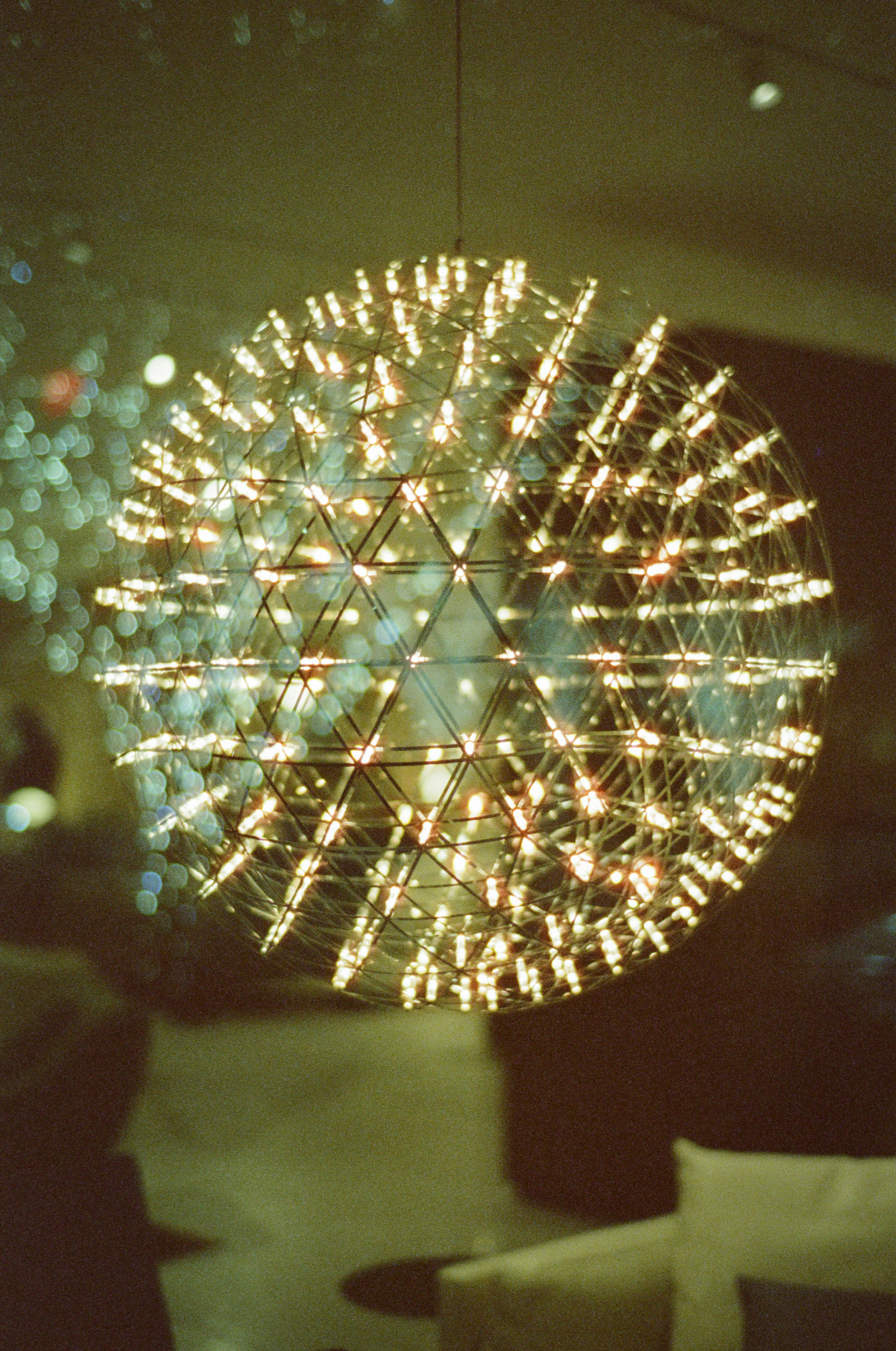 A spherical light fixture with many small bulbs.