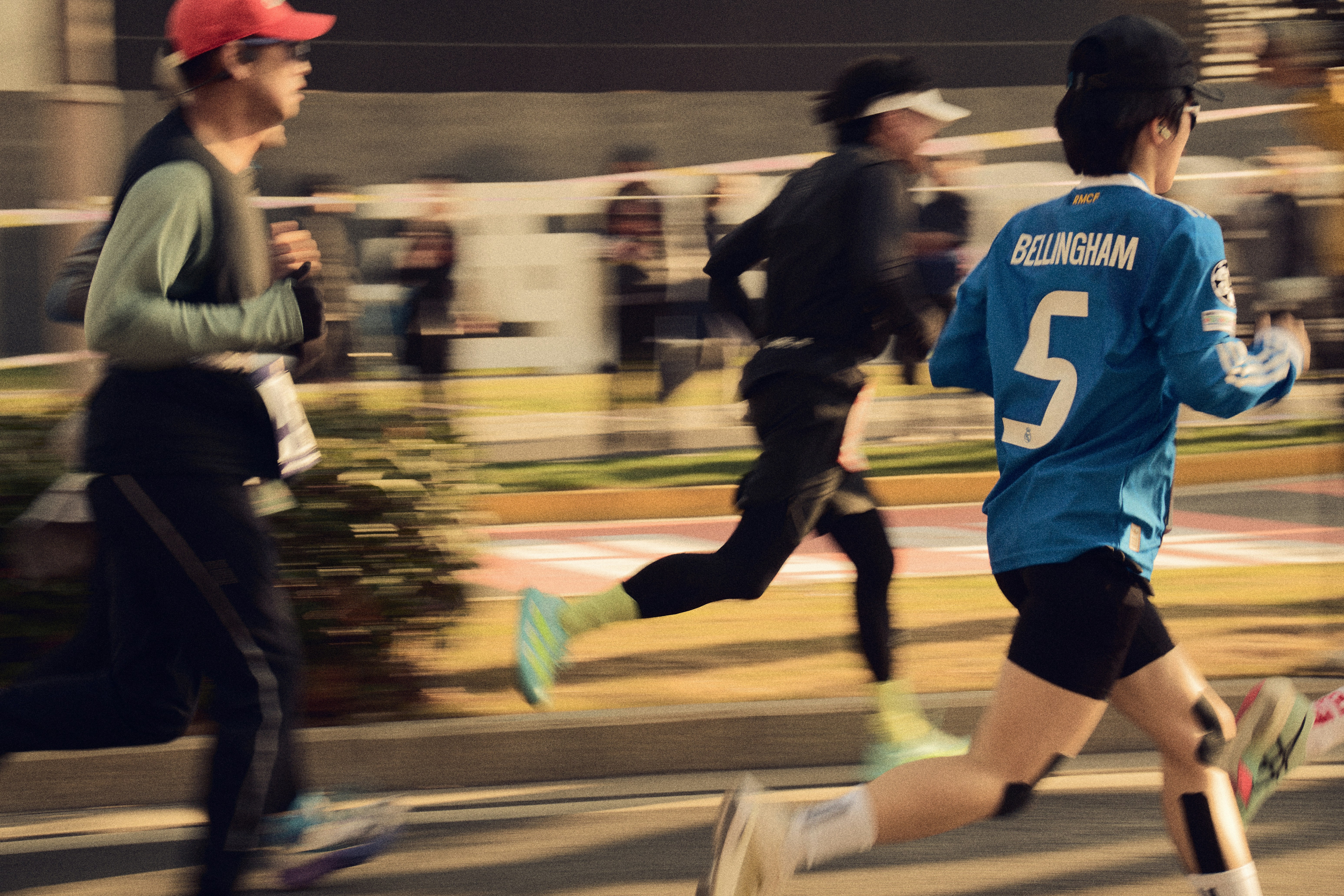 Three runners in a race, motion blurred