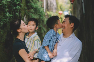 Family sharing a tender moment outdoors