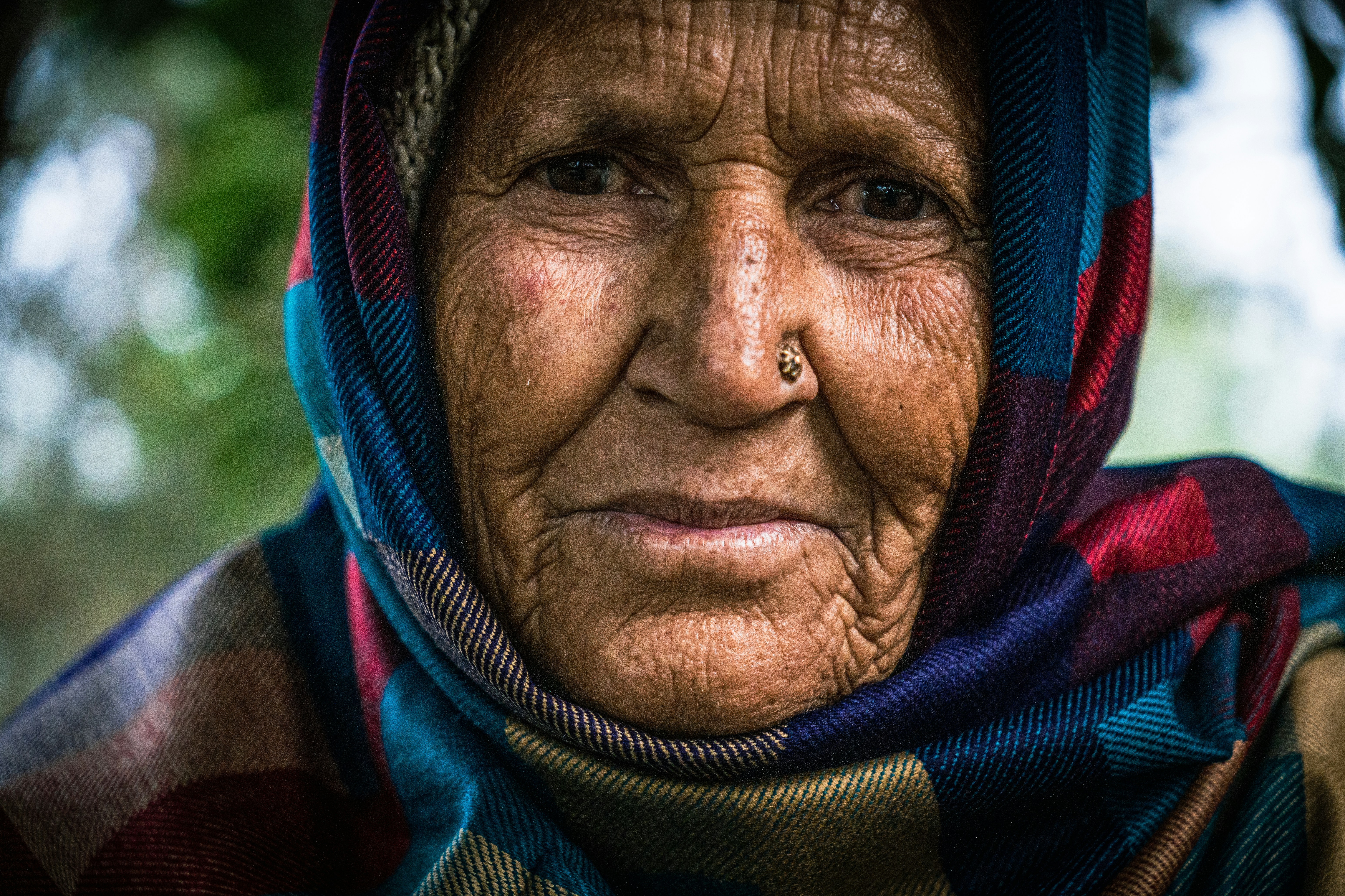 Elderly woman with a colorful scarf