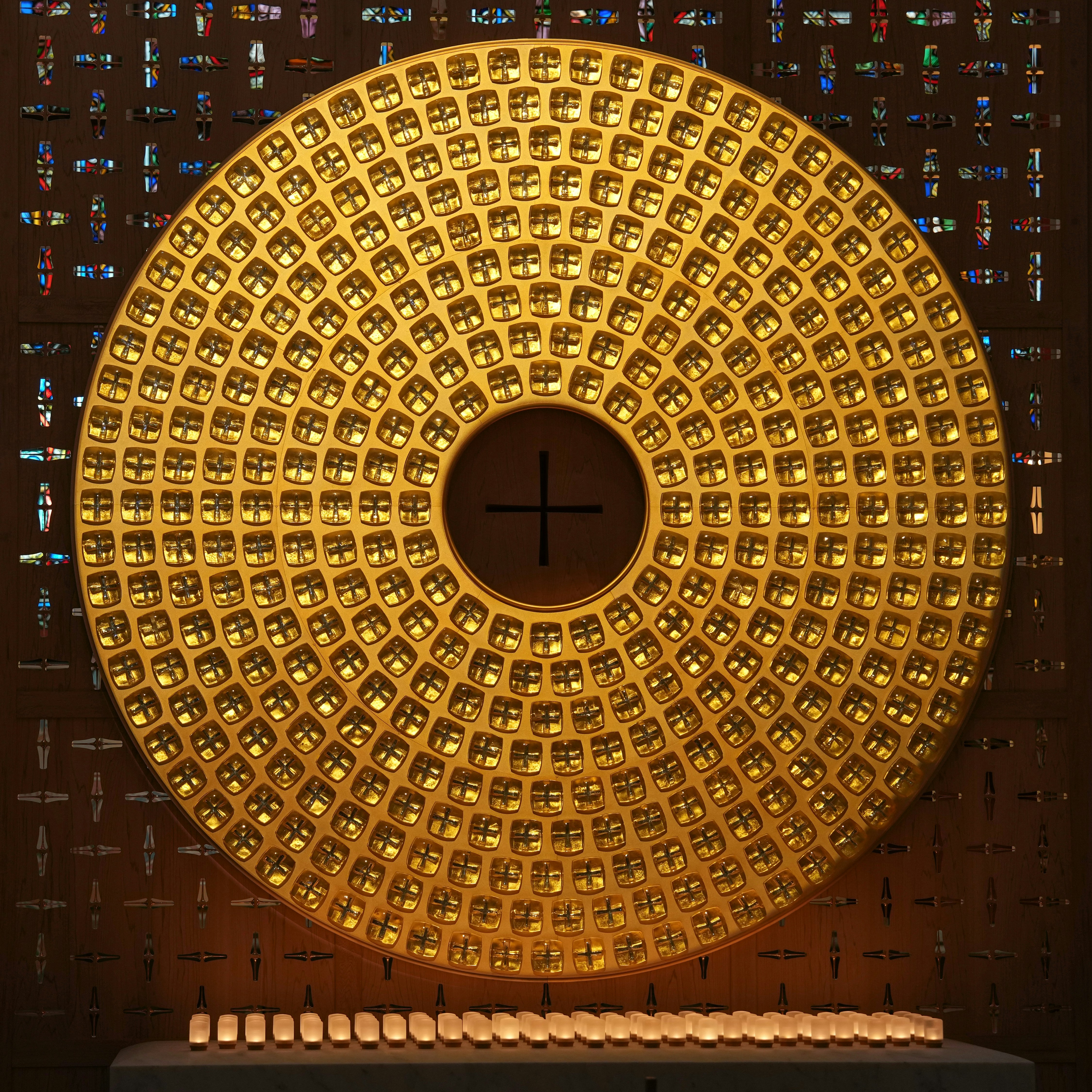 Circular golden disc with many small lights