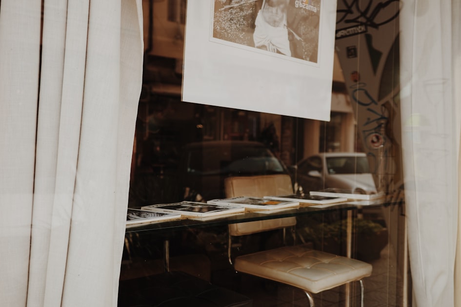 A vintage desk with chairs and photos visible items