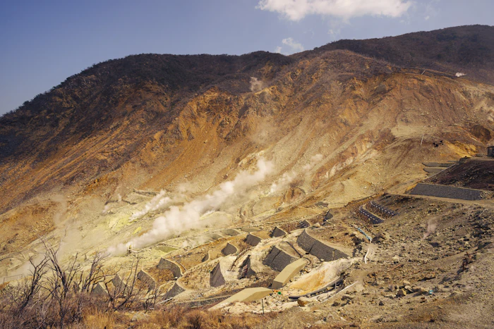 Steam rising from volcanic vents on a mountainside