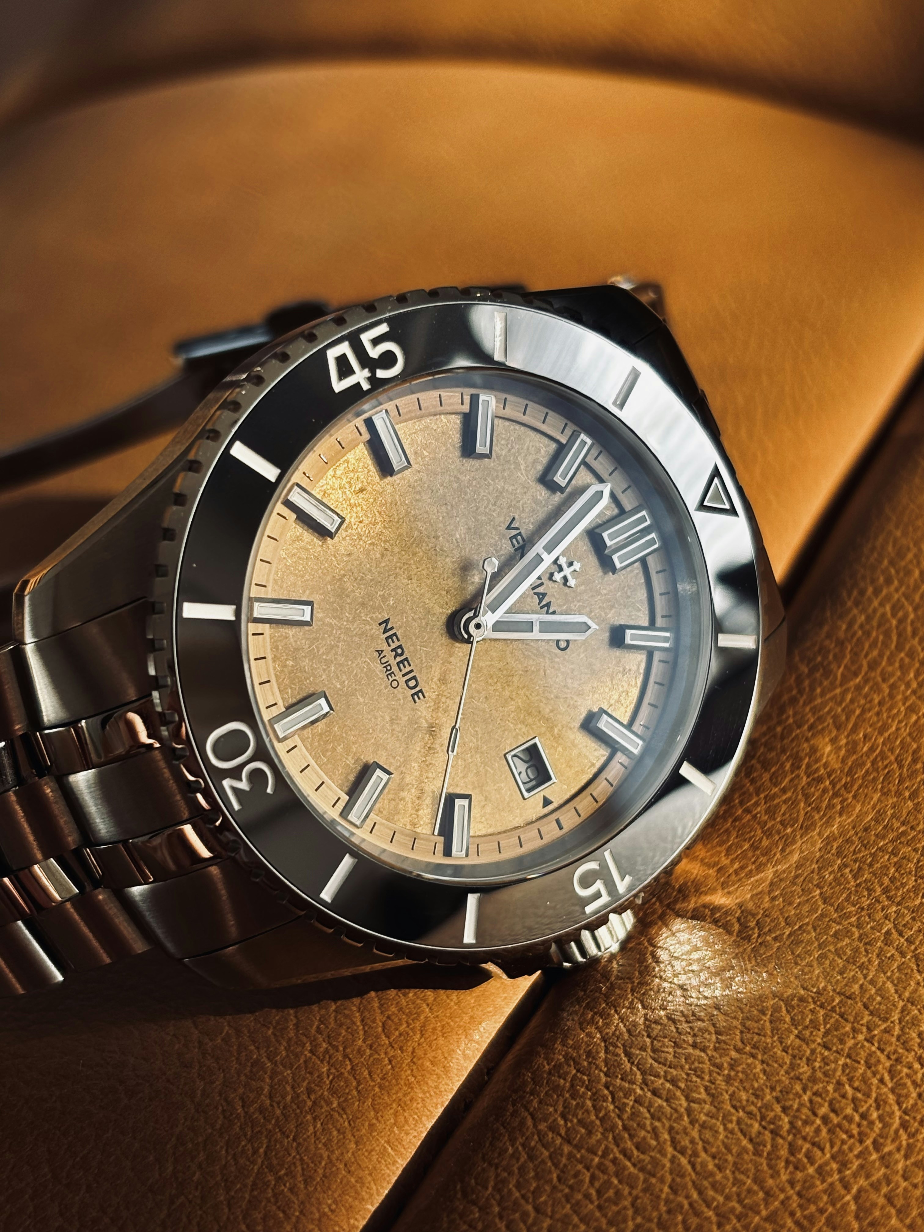 Close-up of a vintage-style dive watch on leather.