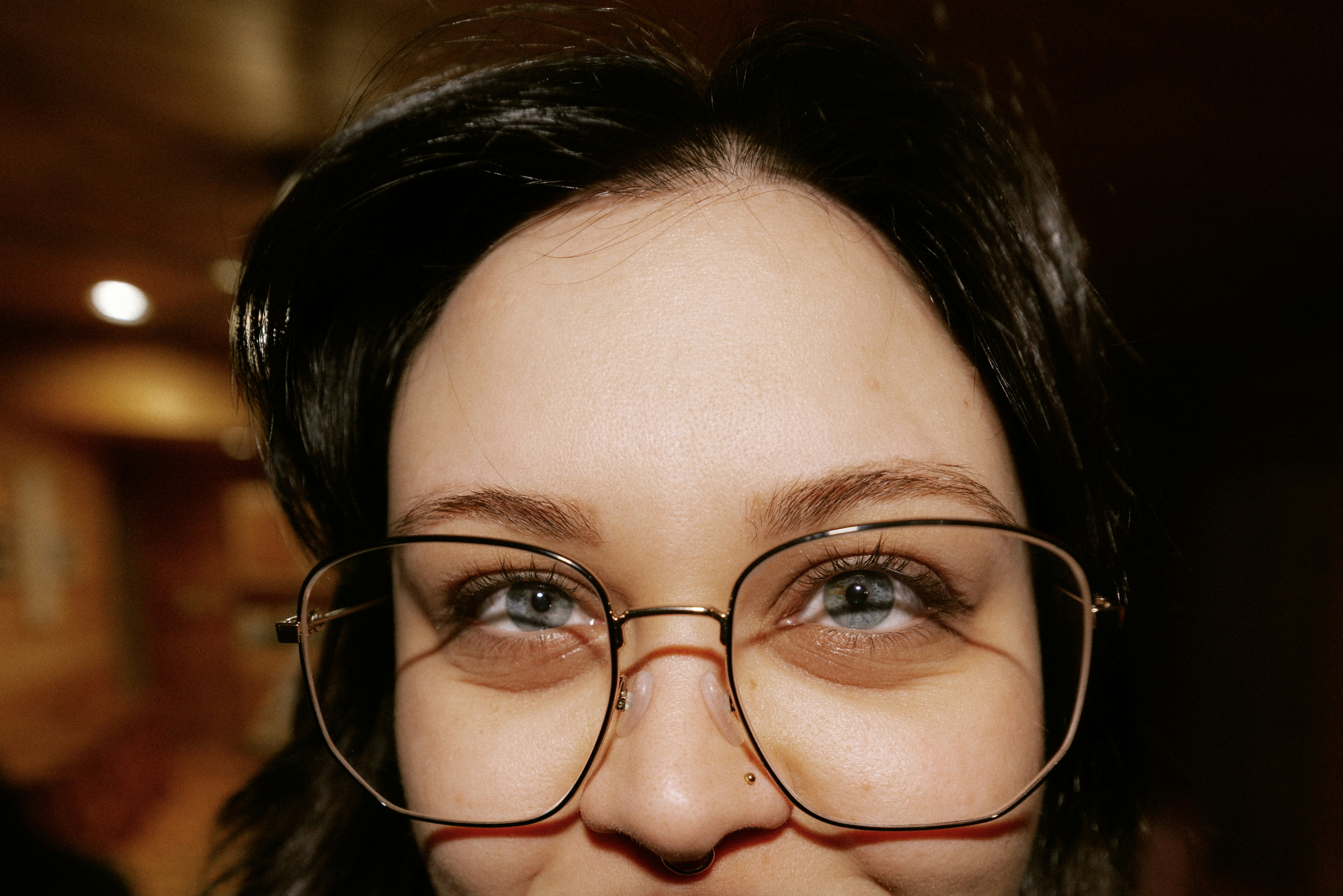 Close-up of a woman wearing large glasses