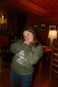 Young woman with down syndrome posing indoors.