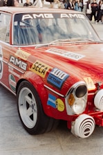 Red vintage amg race car with sponsor decals