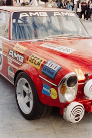 Red vintage amg race car with sponsor decals