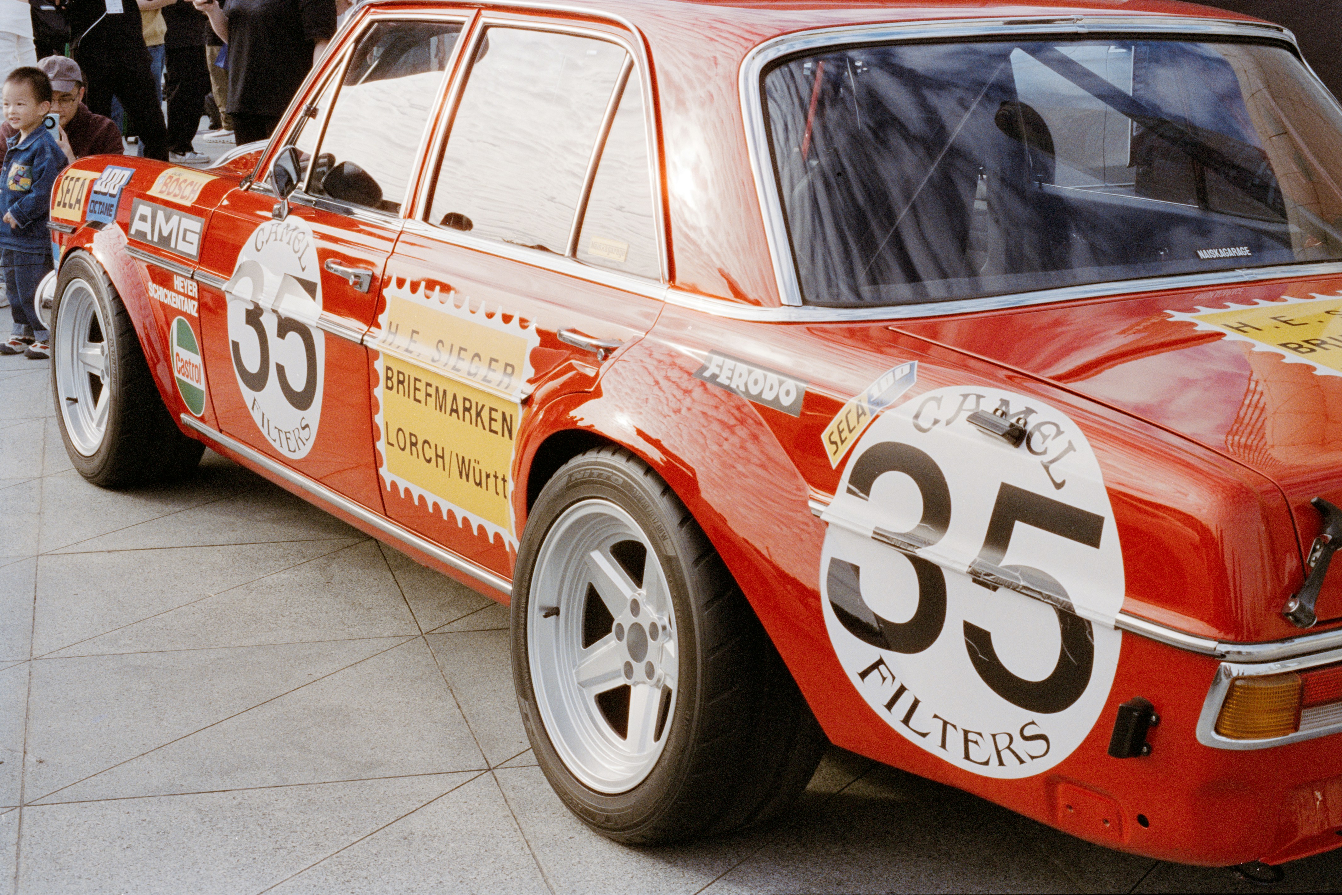 Red vintage race car with number 35