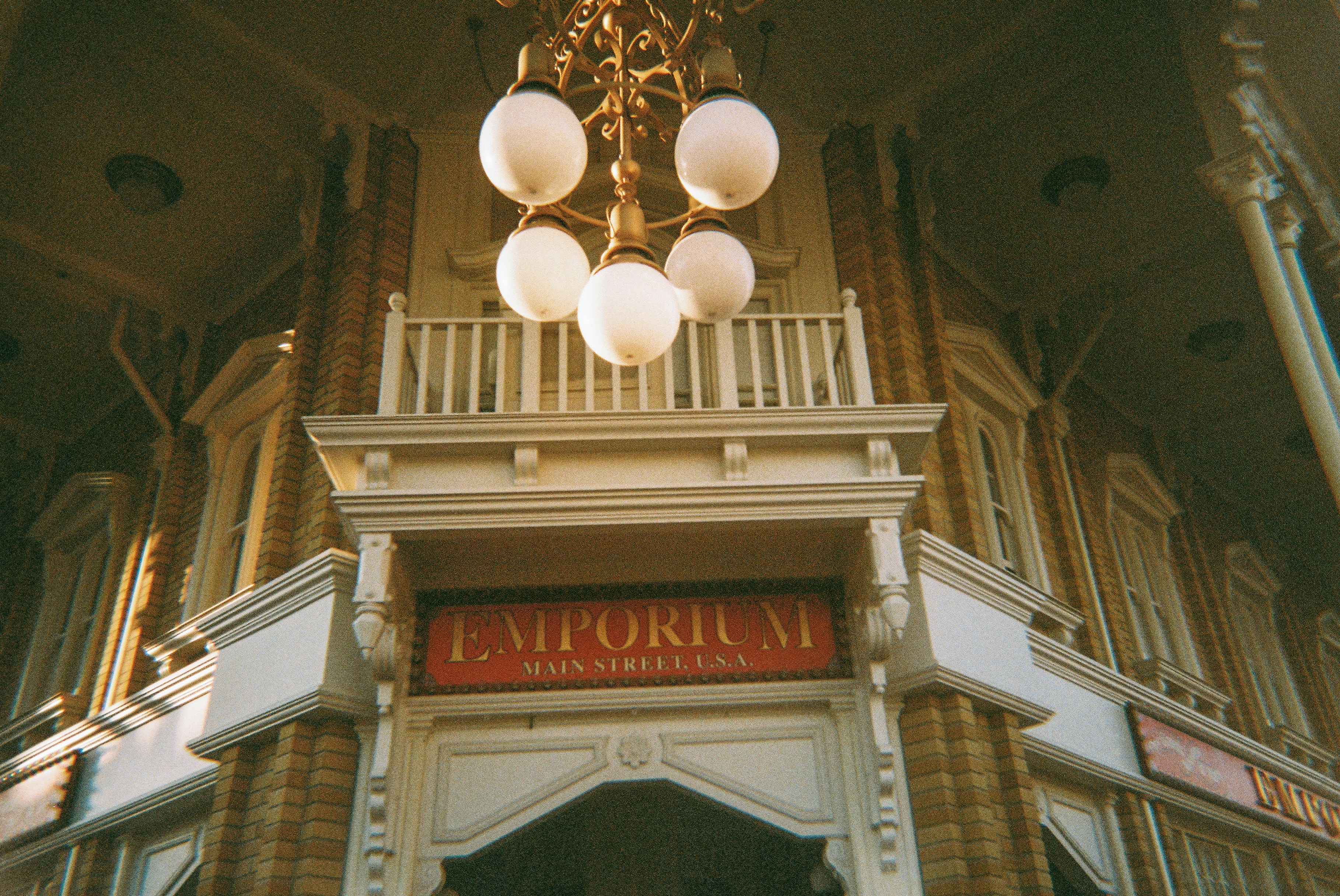 Ornate emporium entrance with decorative chandelier overhead lighting