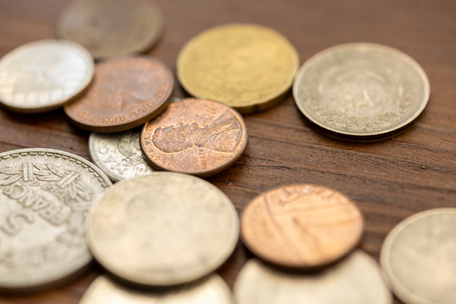 Vintage coins on a wood surface for railroad history collection