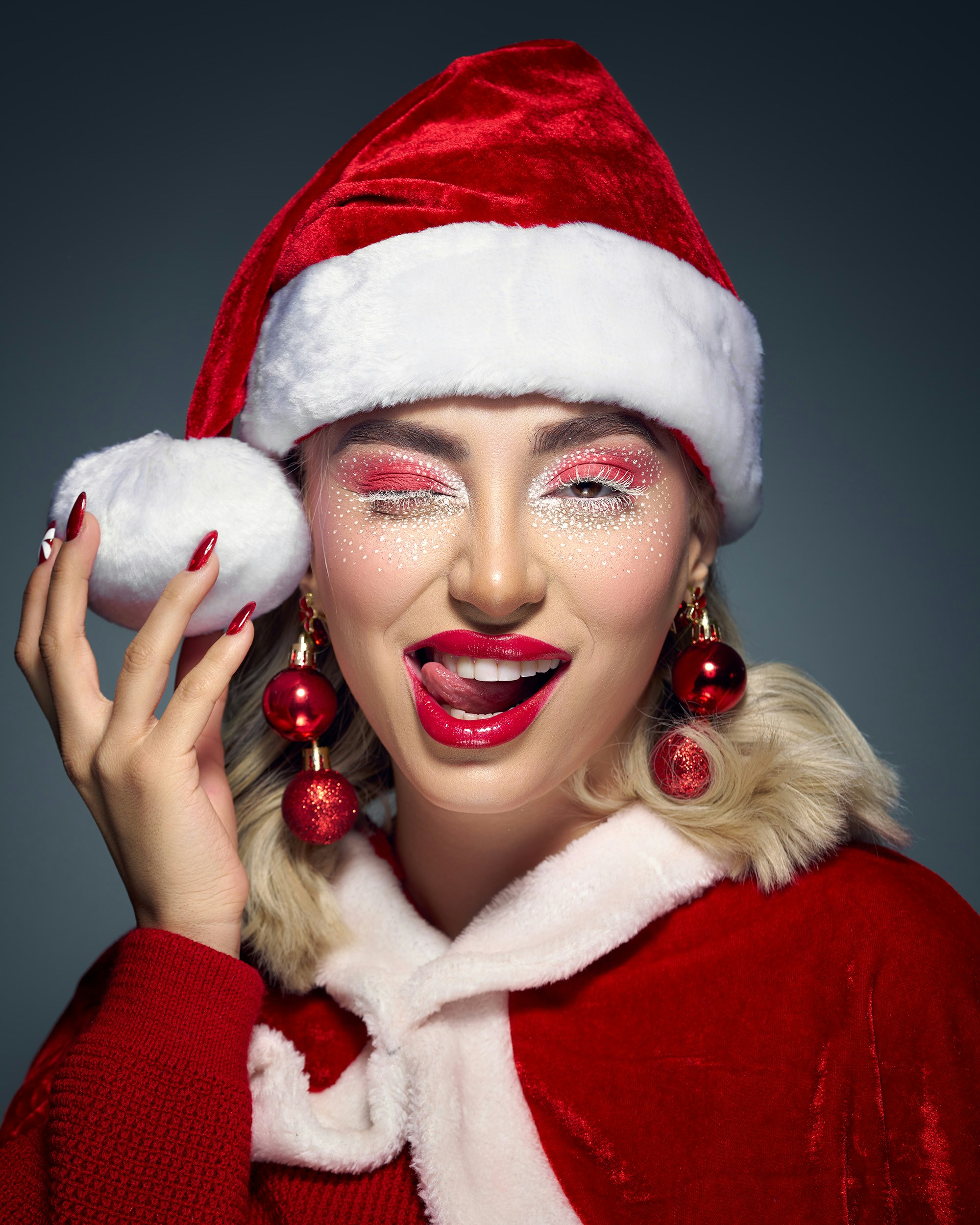 Woman in santa costume with festive makeup