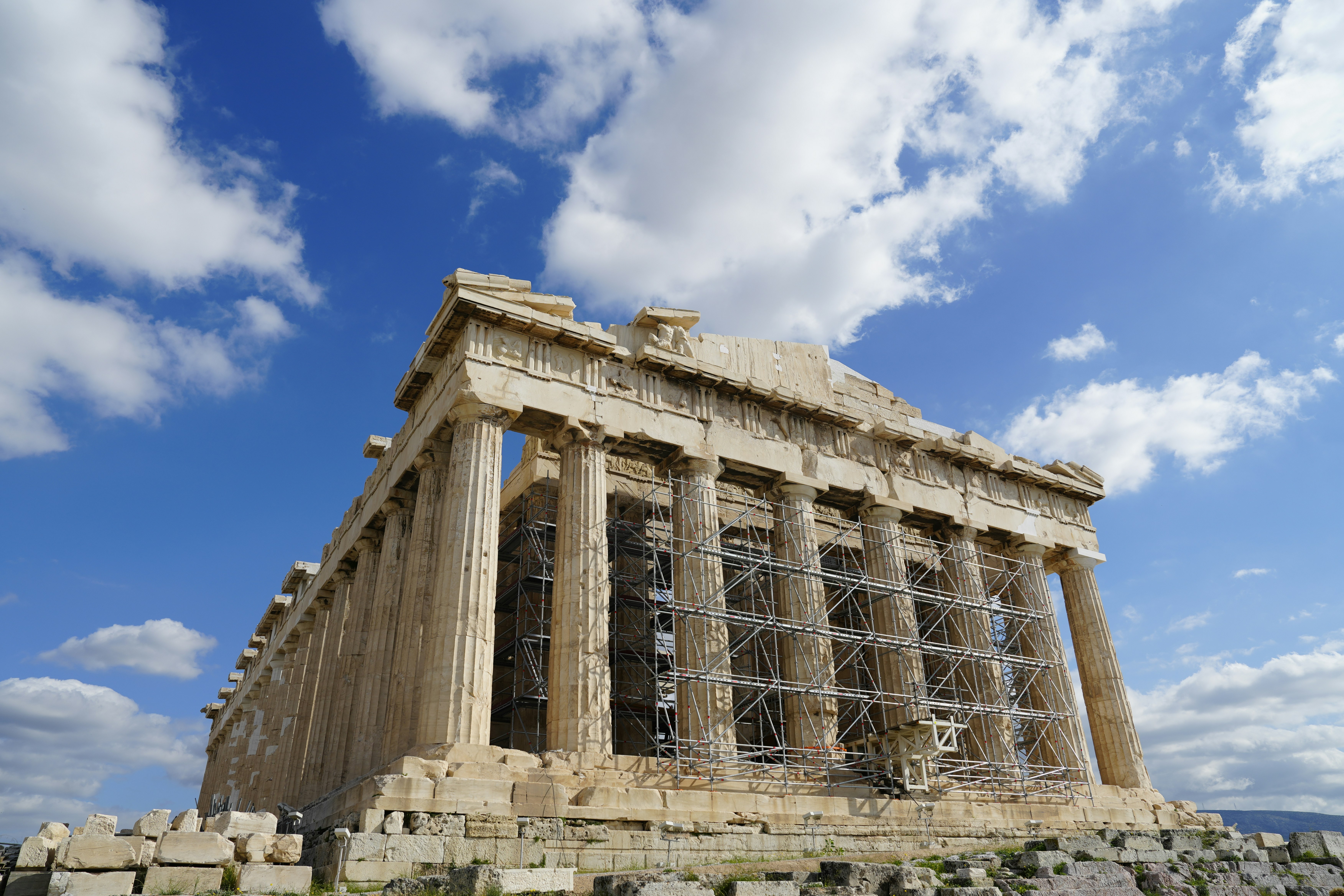 Parthenon temple with scaffolding against blue sky