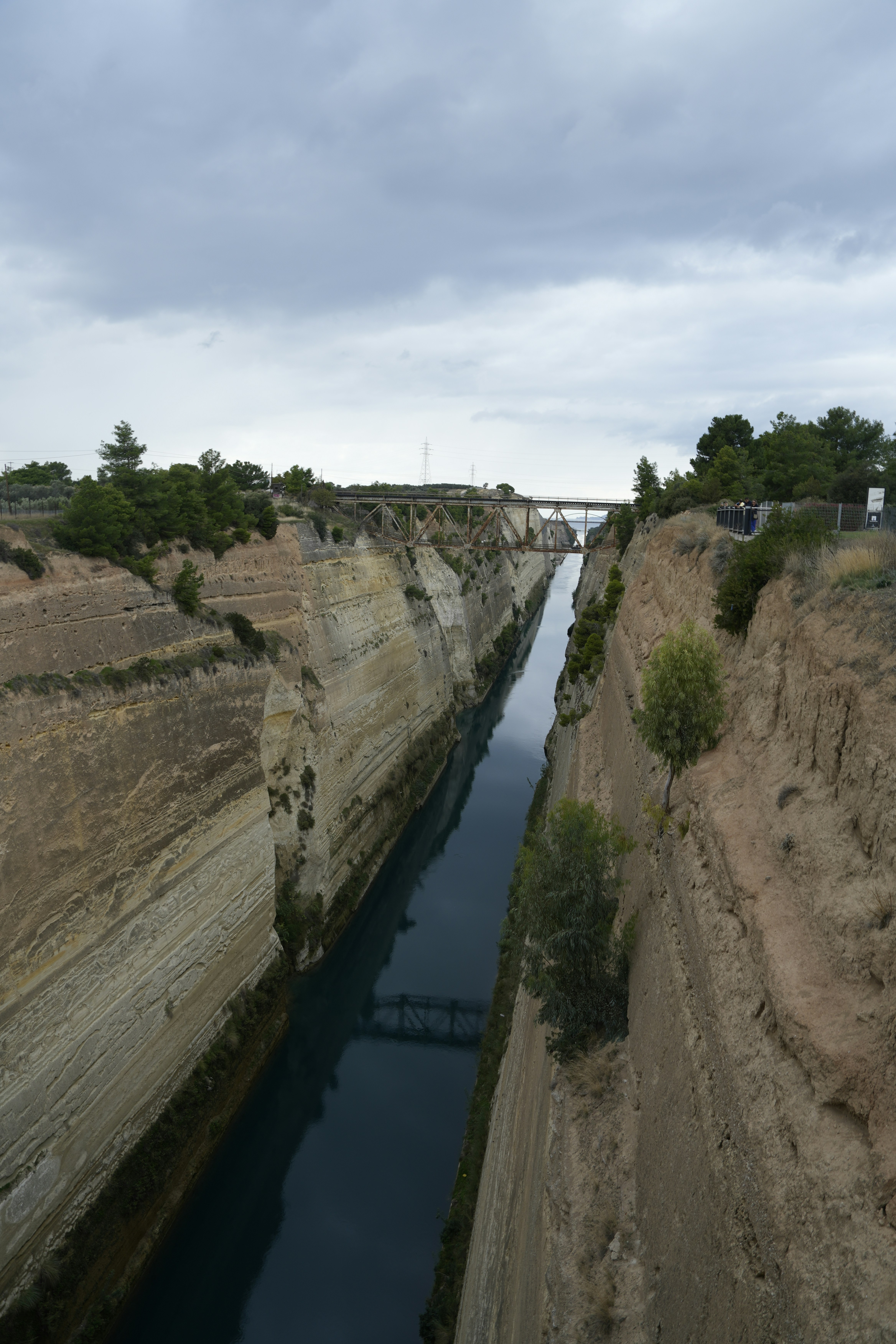 A narrow canal carved between steep rock walls.