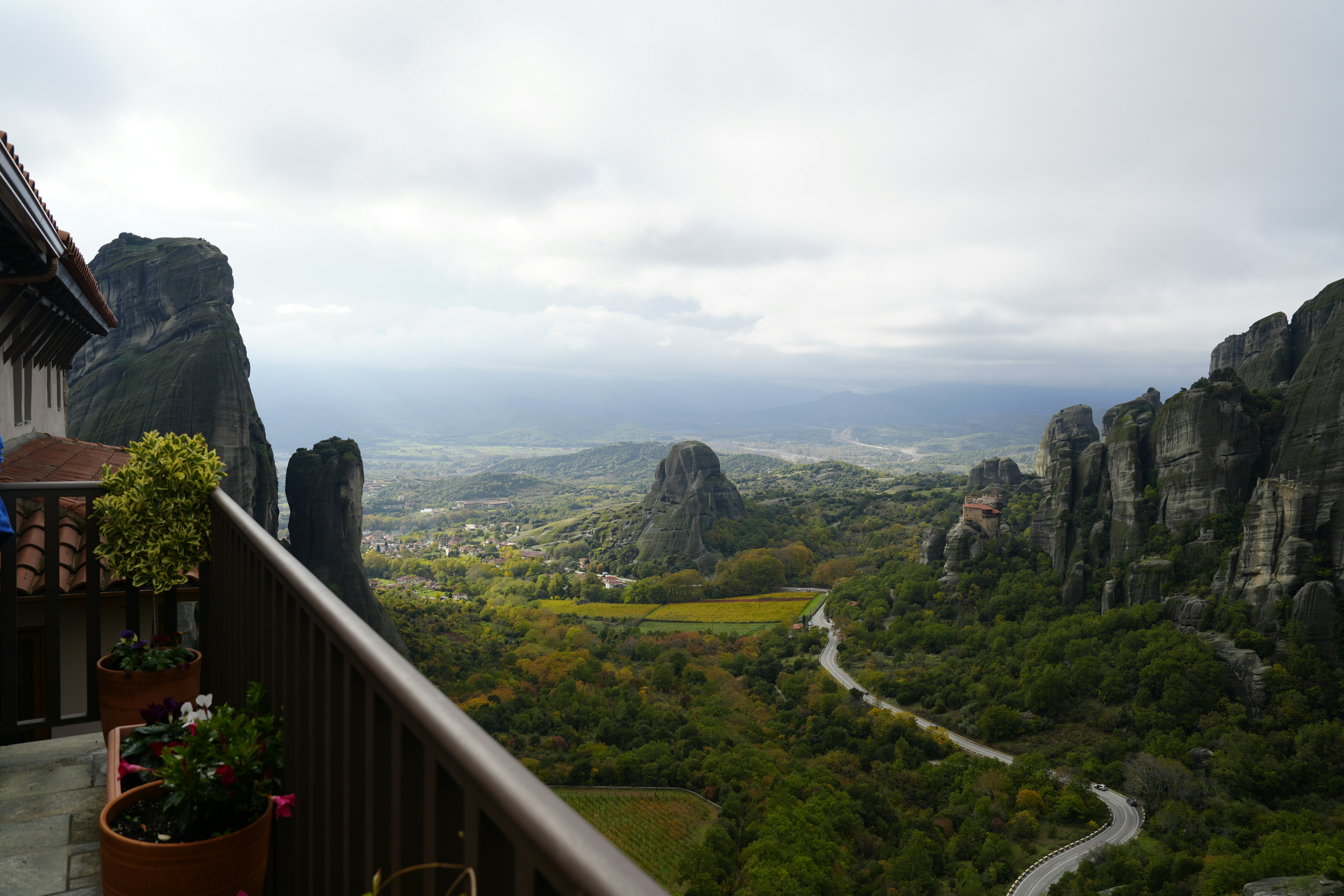 Monastery buildings on rocky cliffs overlooking a valley