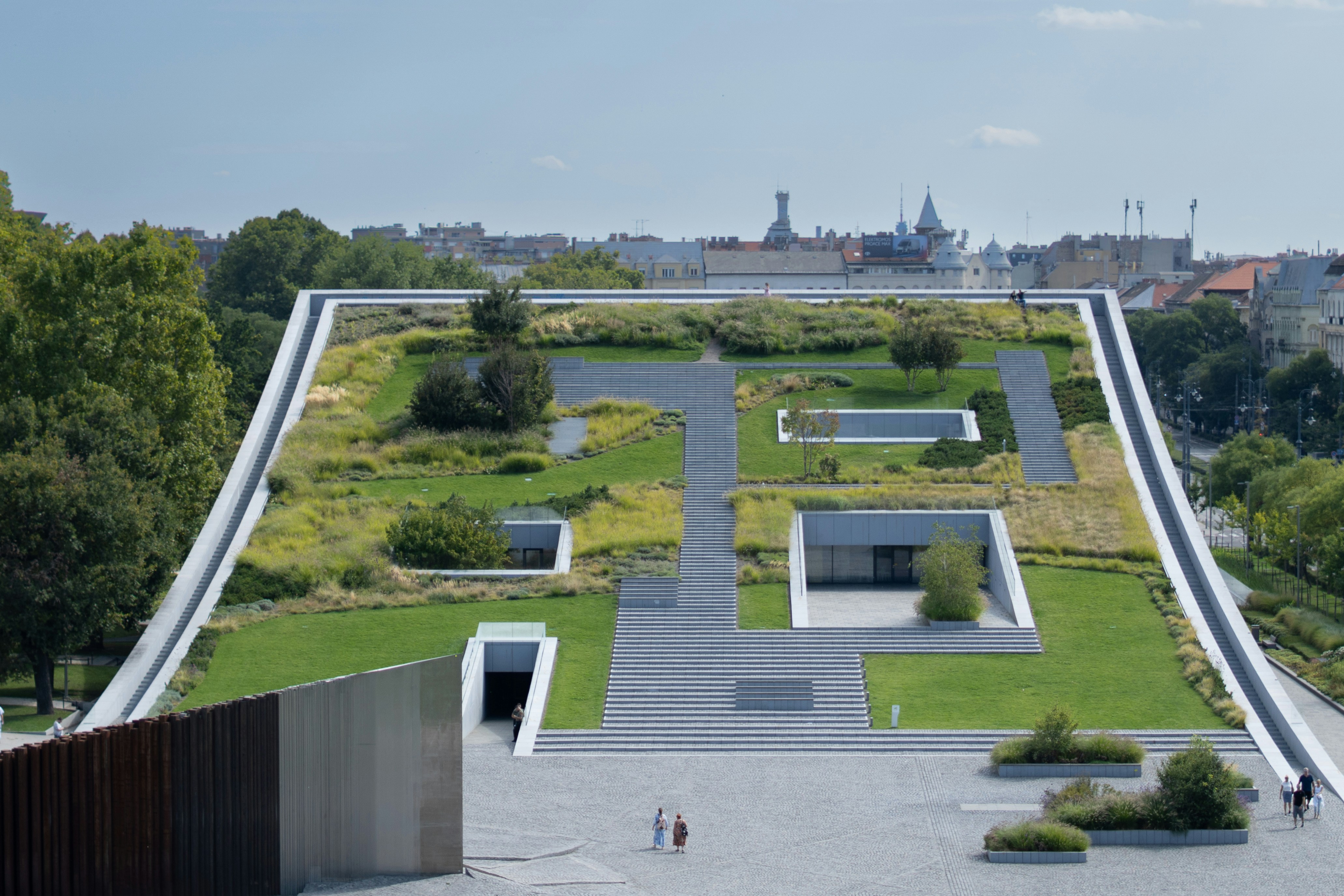 Modern building with a green roof and geometric design