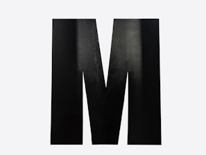 A large black letter m on a white background