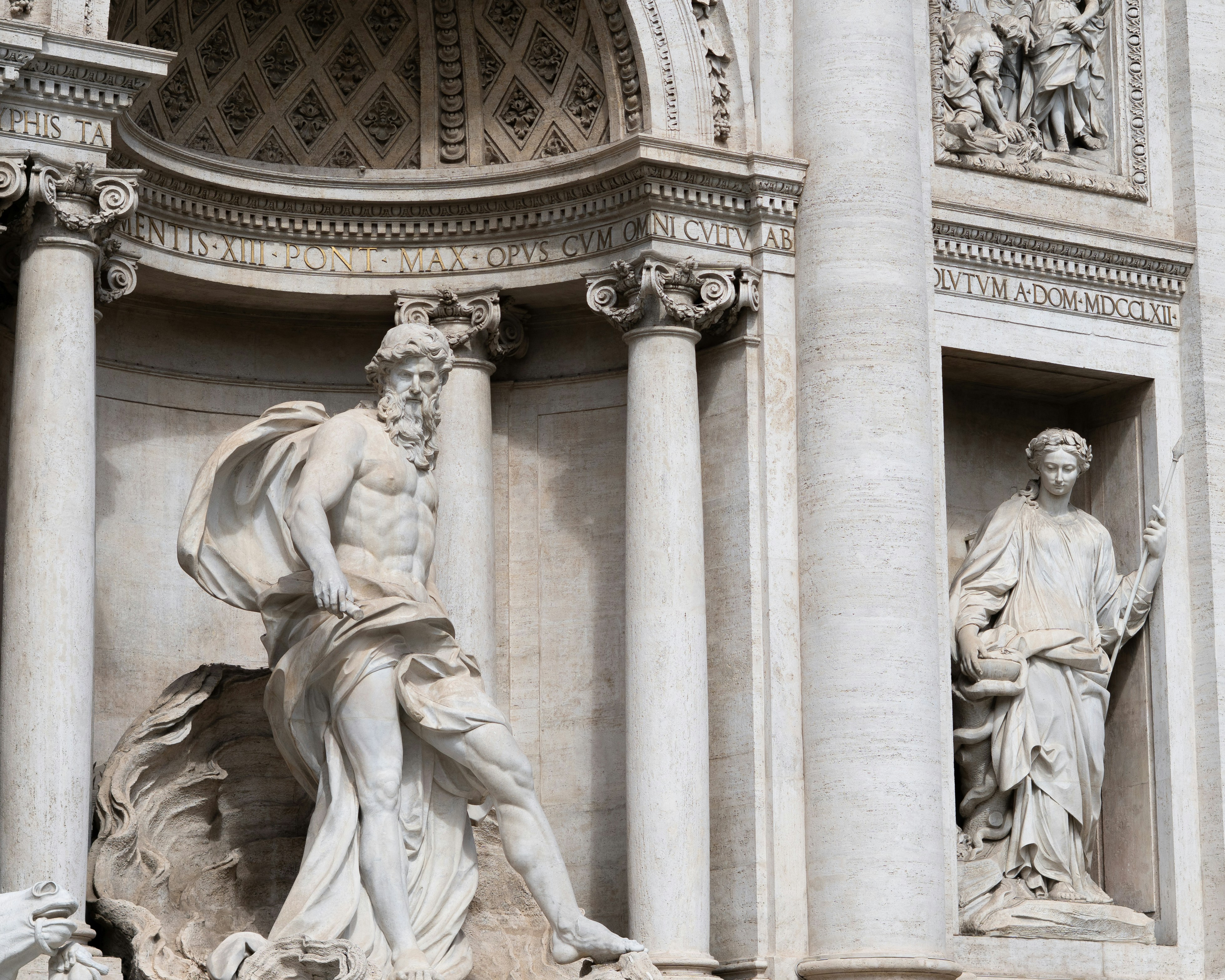Baroque statues adorn a grand marble fountain