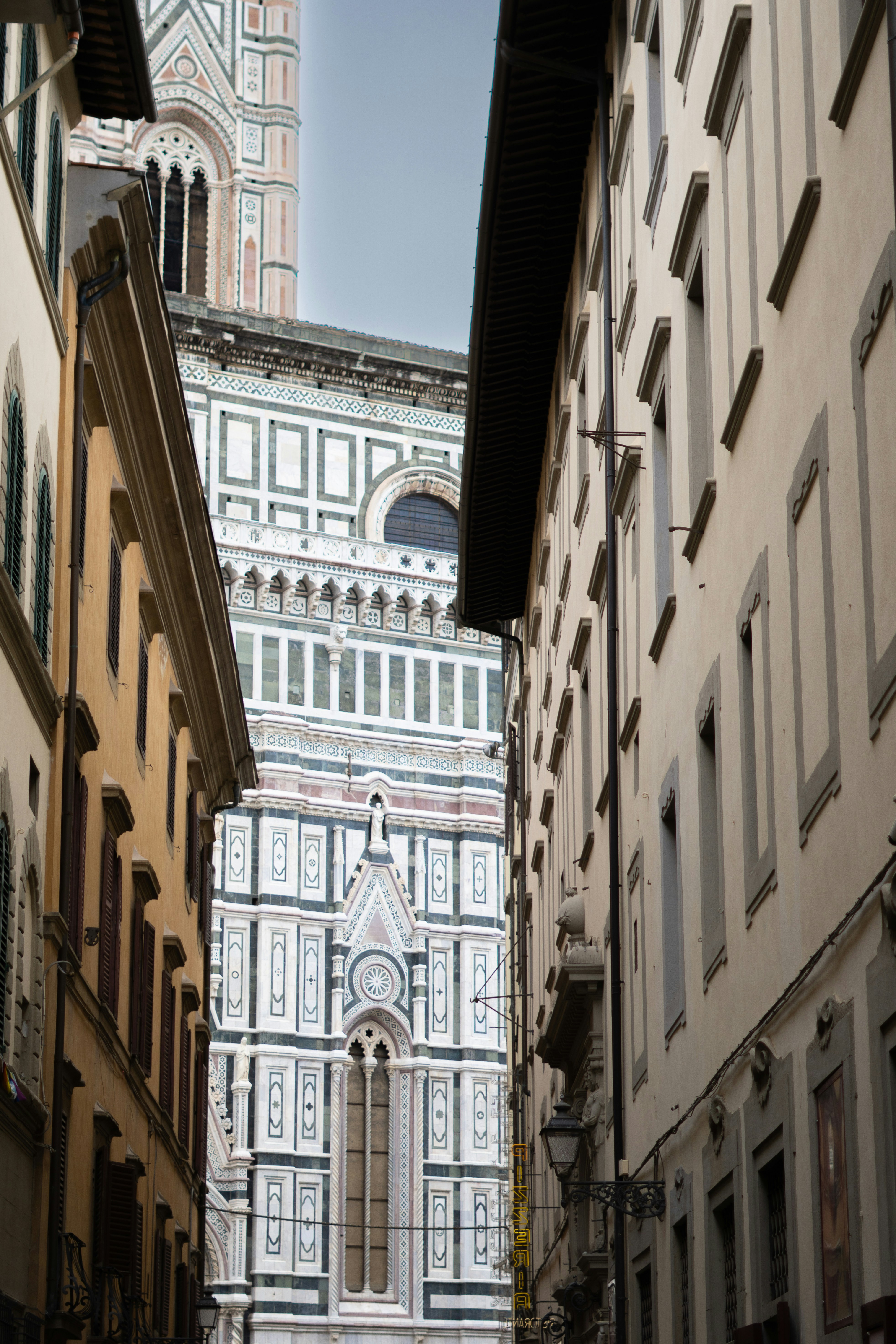 Historic building facade viewed between narrow city streets