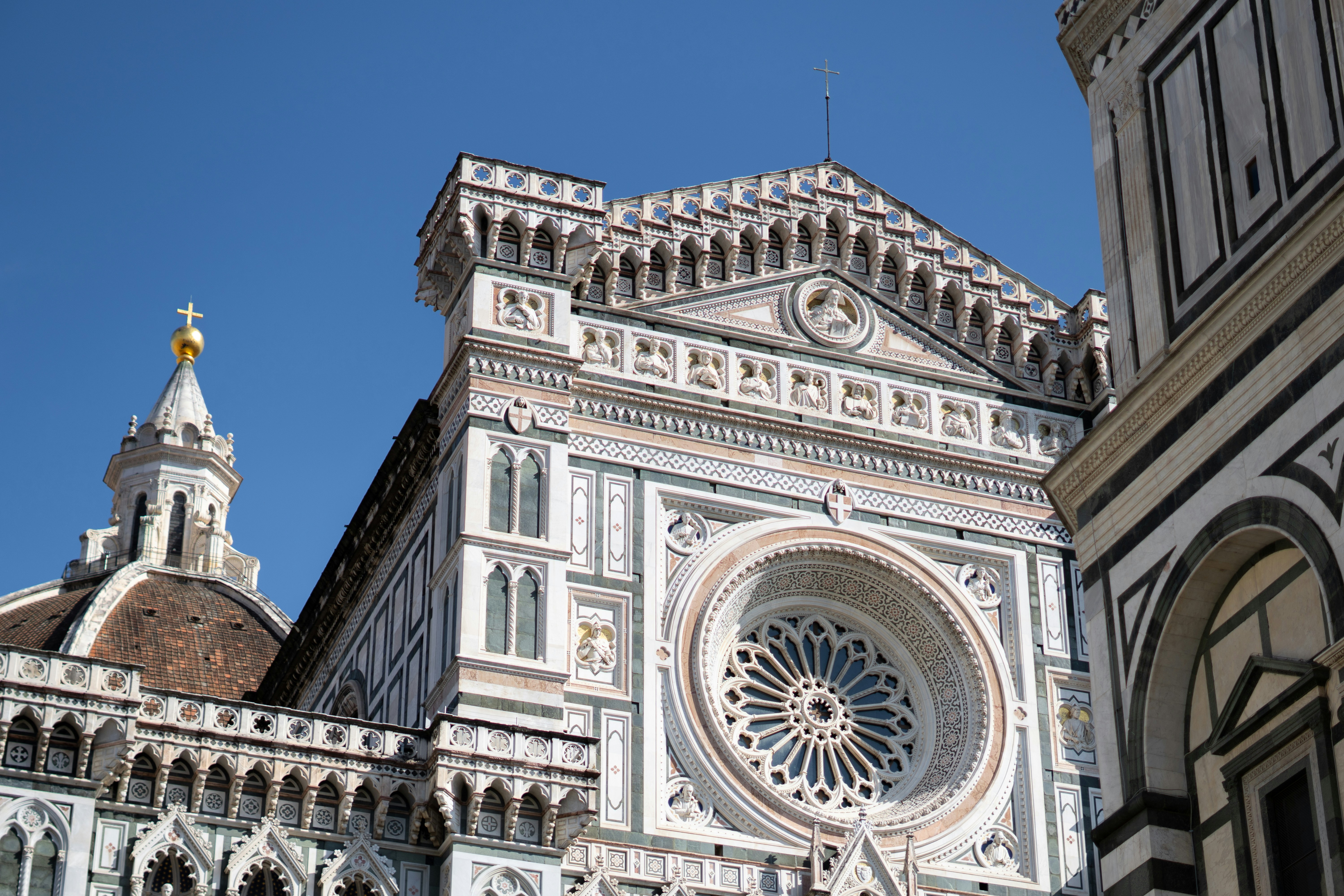 Ornate facade of a grand cathedral under blue sky