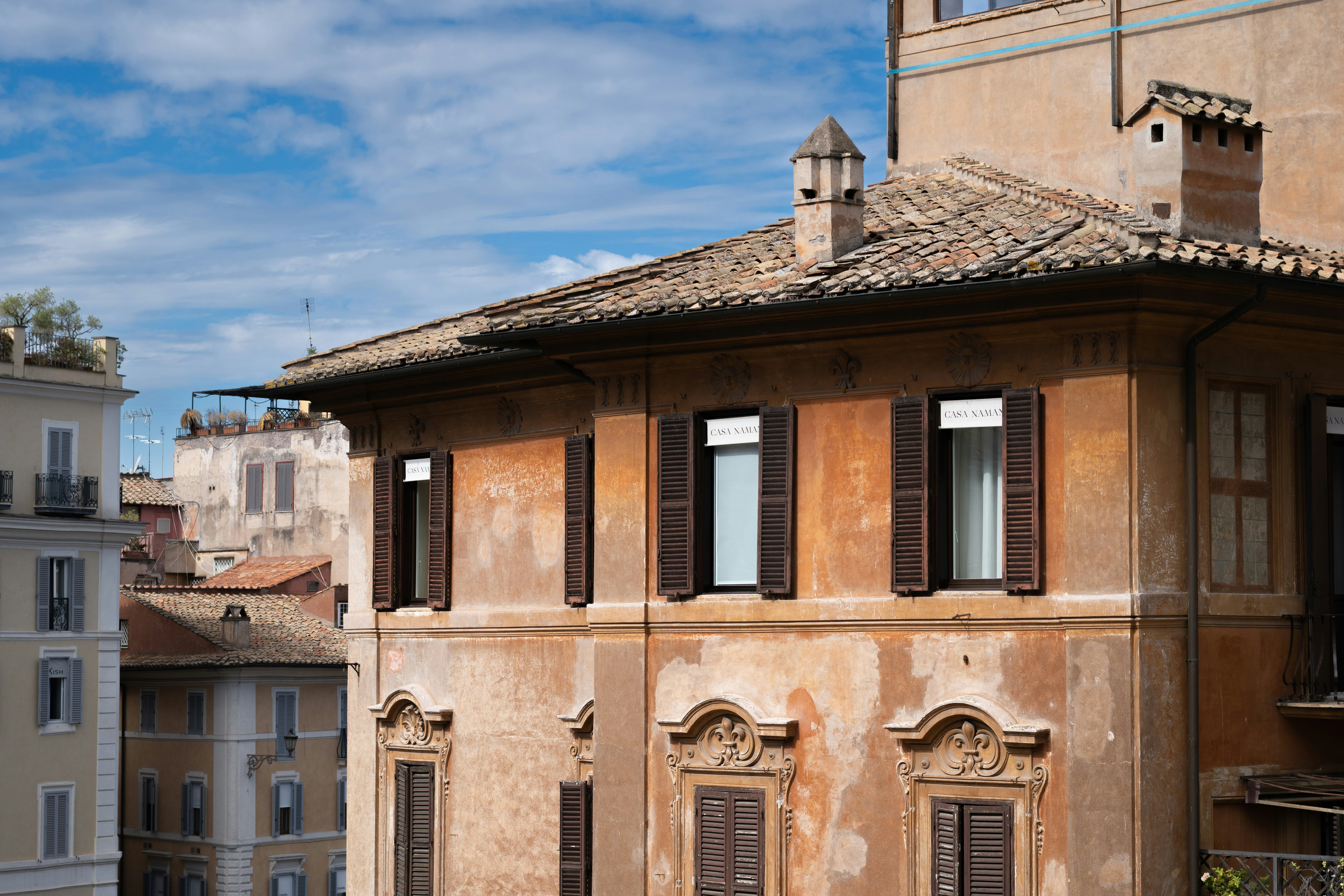 Old building facade with windows and shutters