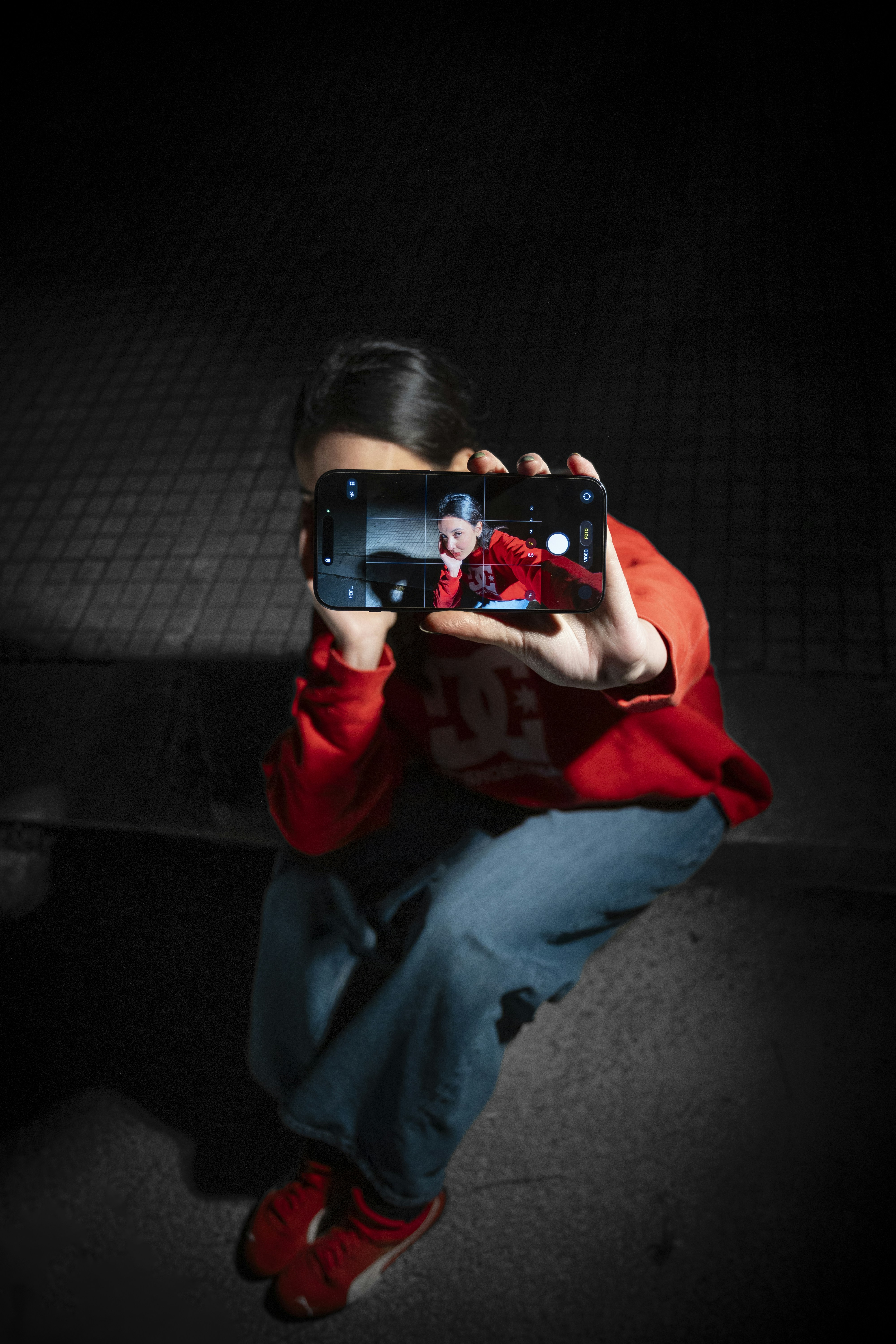 Person taking a selfie with a smartphone