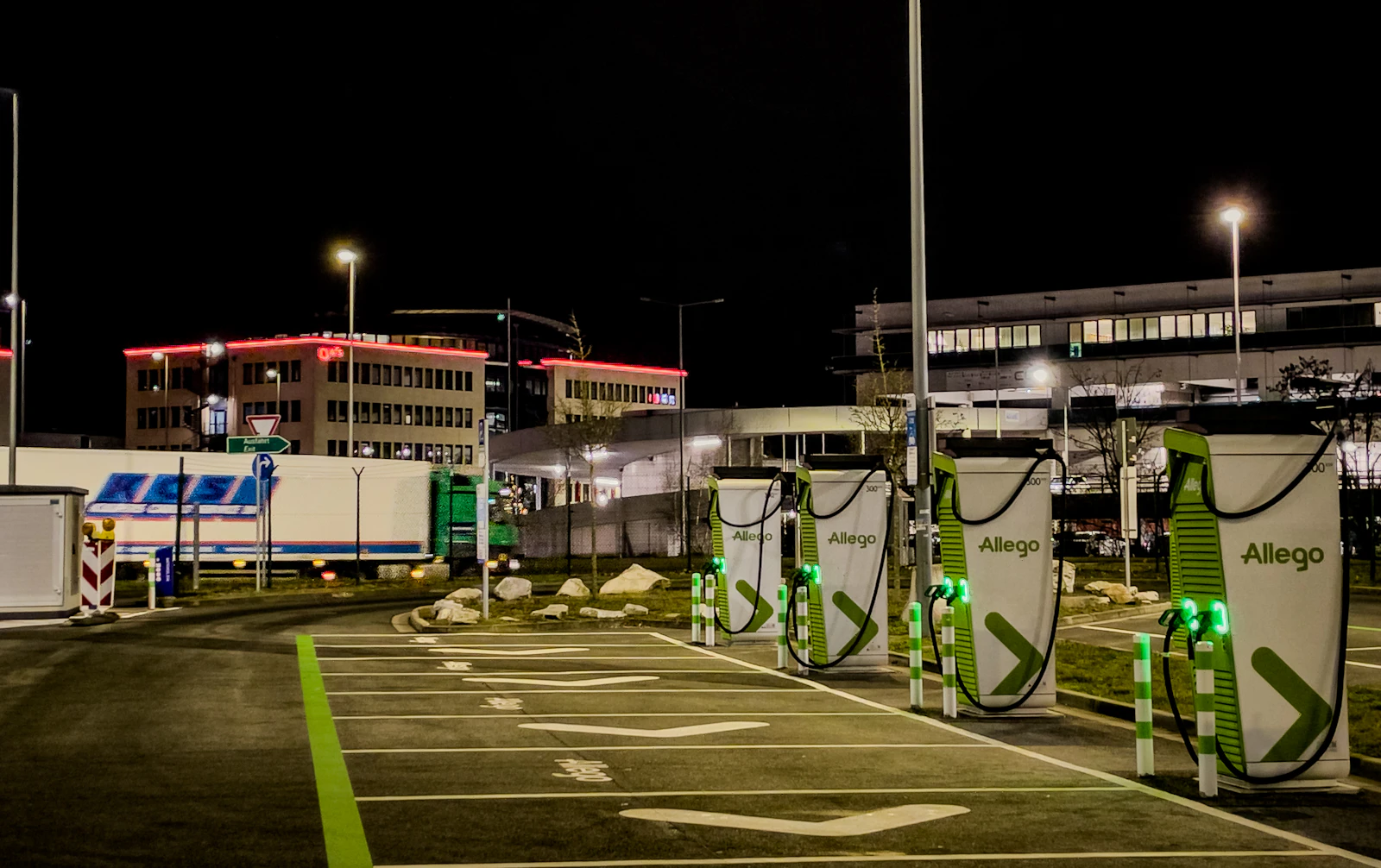 Row of EV charging stations in a commercial parking lot