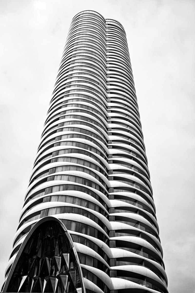 Modern curved tower representing innovation in real estate