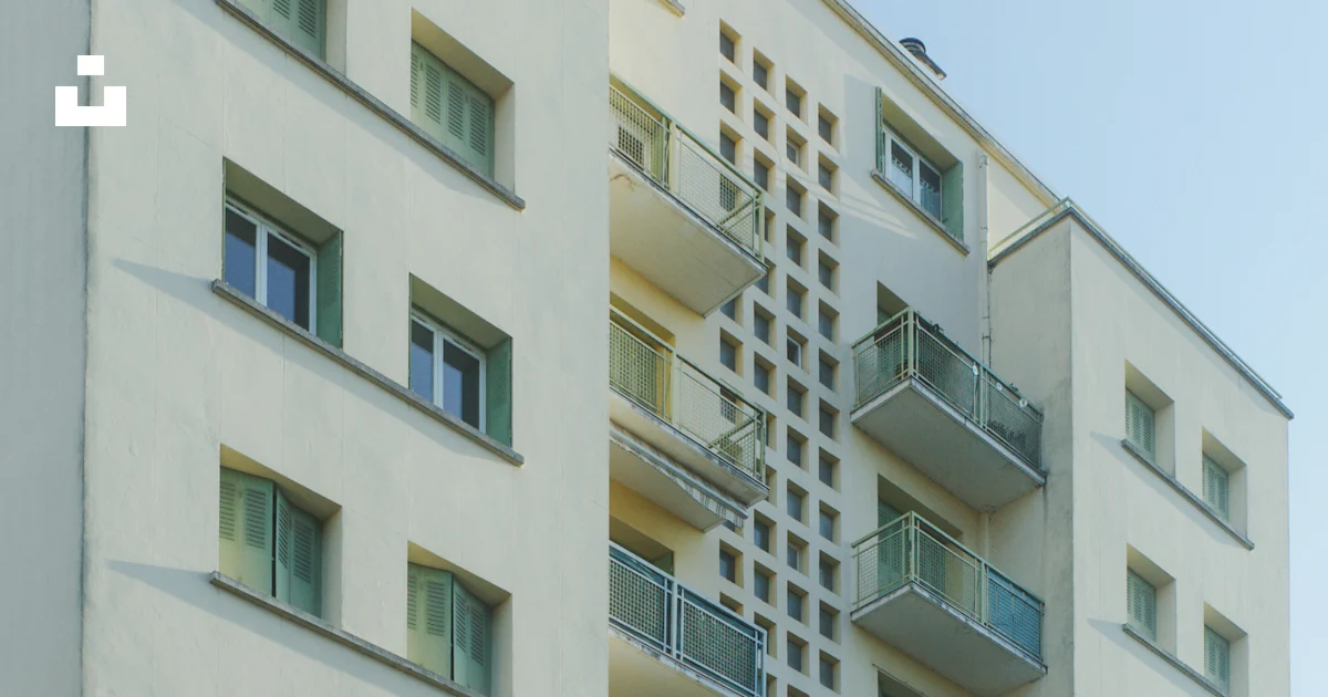 Tall cream-colored apartment building with balconies photo – Free ...