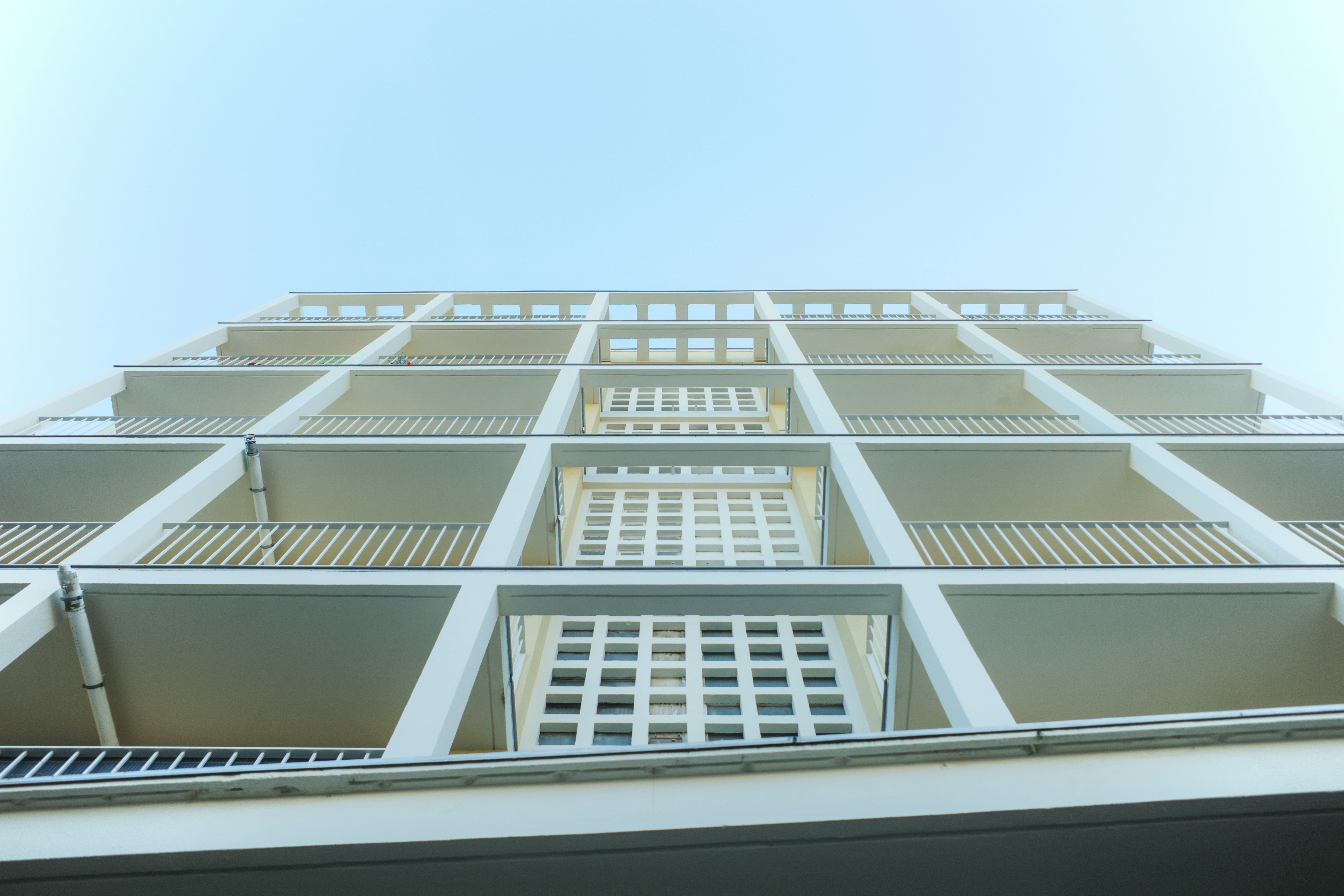 Modern building facade with geometric balconies against sky