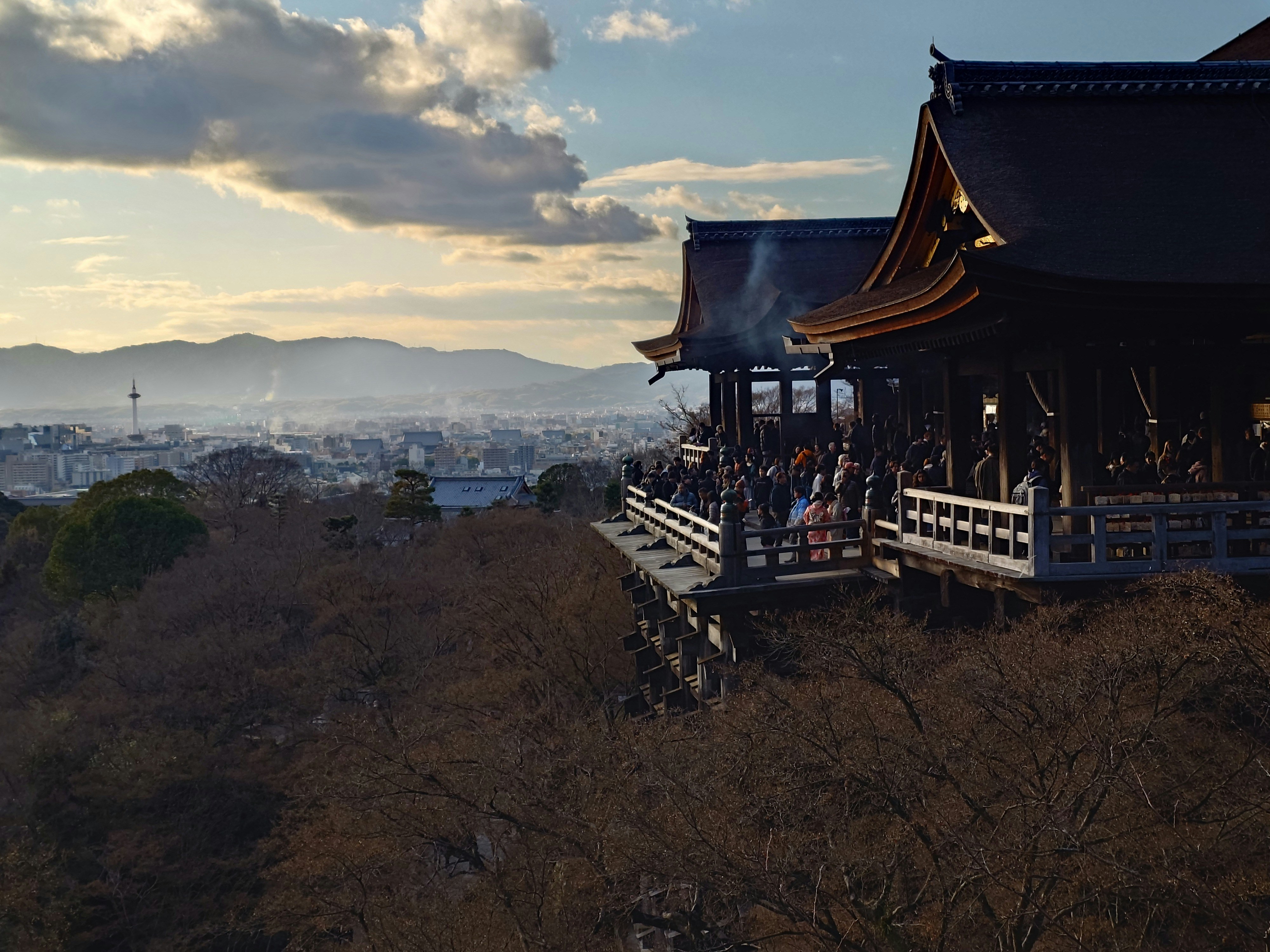 Temple overlooking a city at sunset