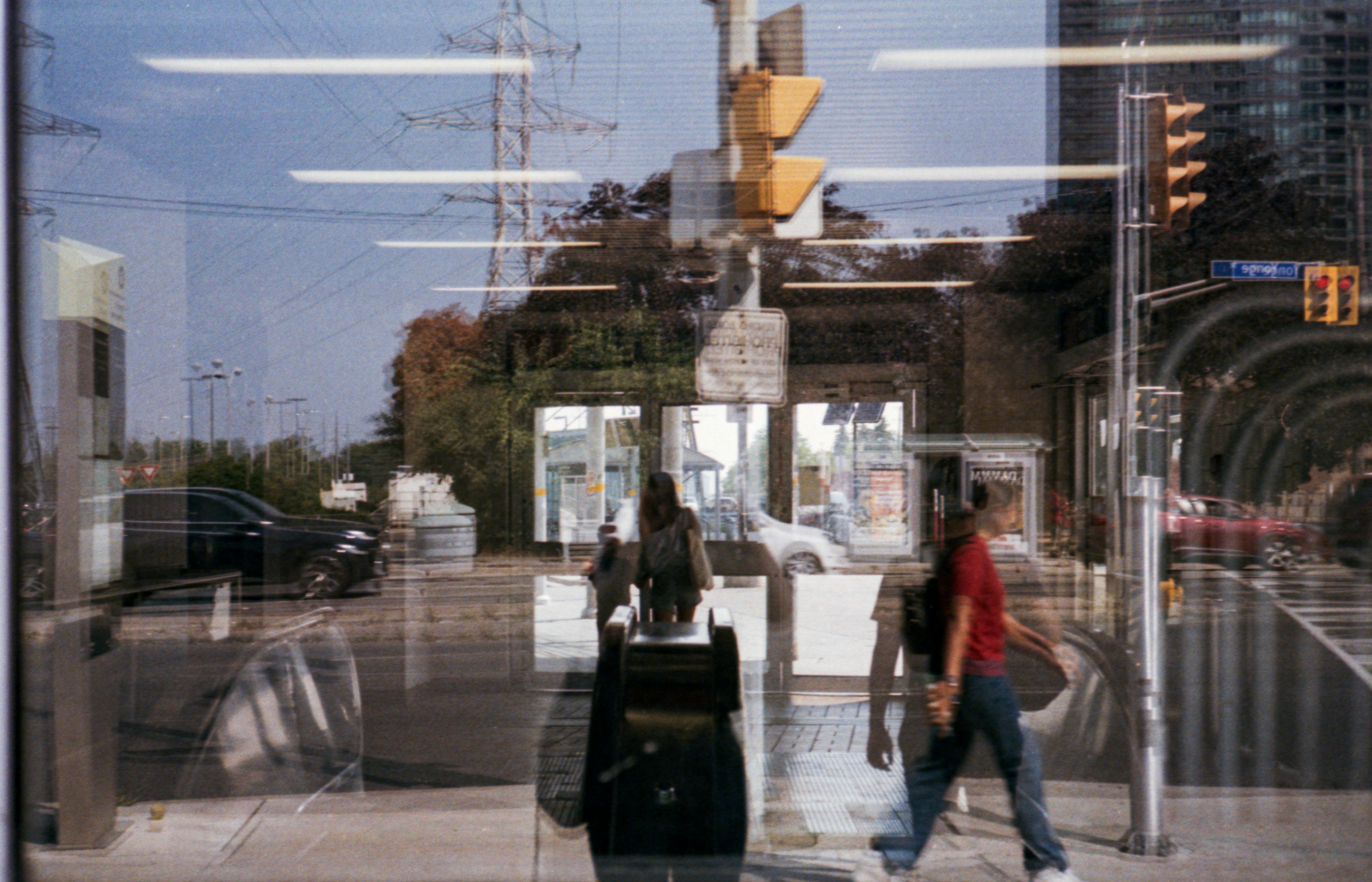 Reflection of city street and people in window