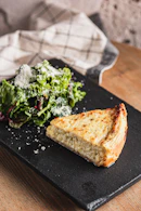 Slice of quiche with a side salad