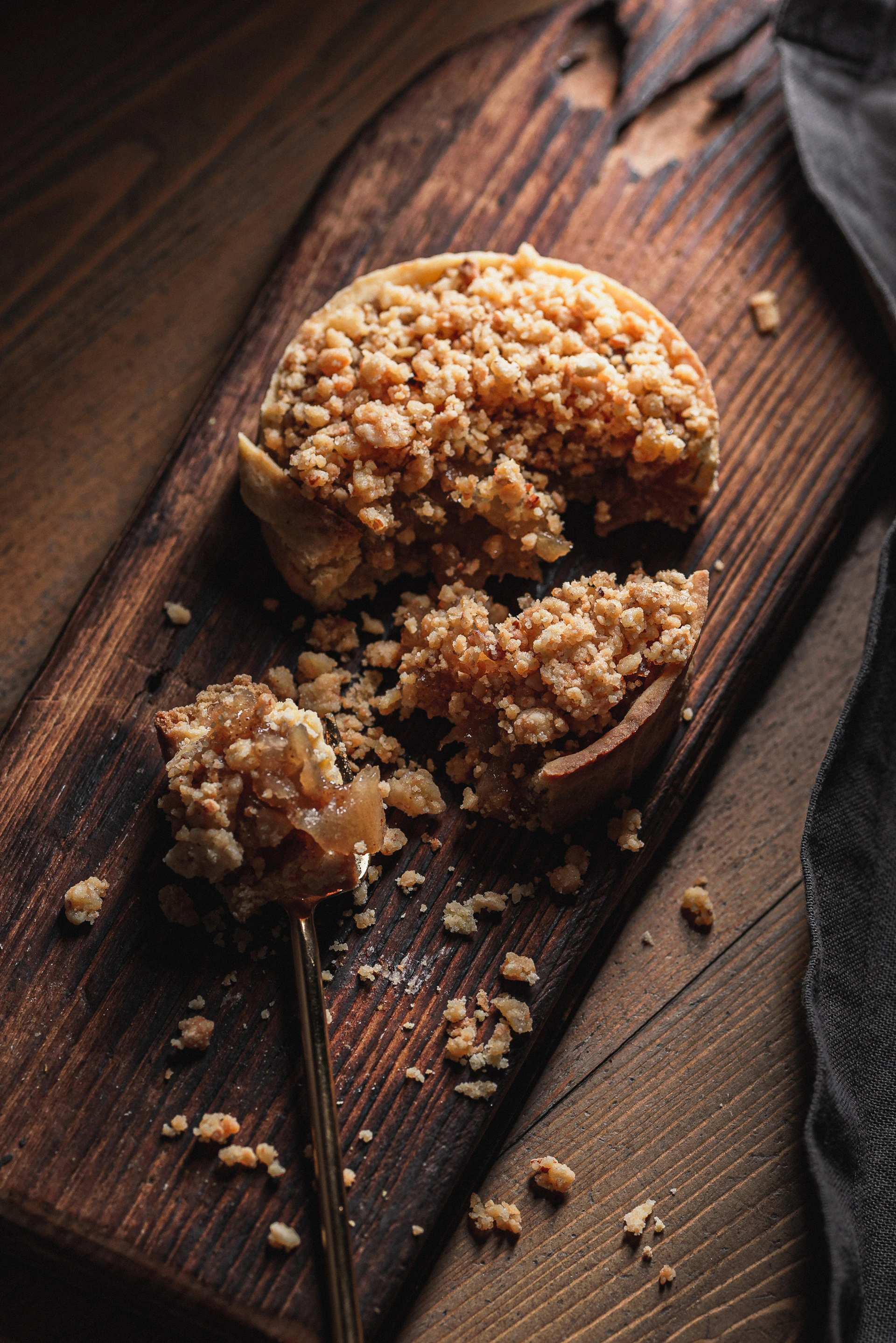 Apple crumble tart on a wooden board