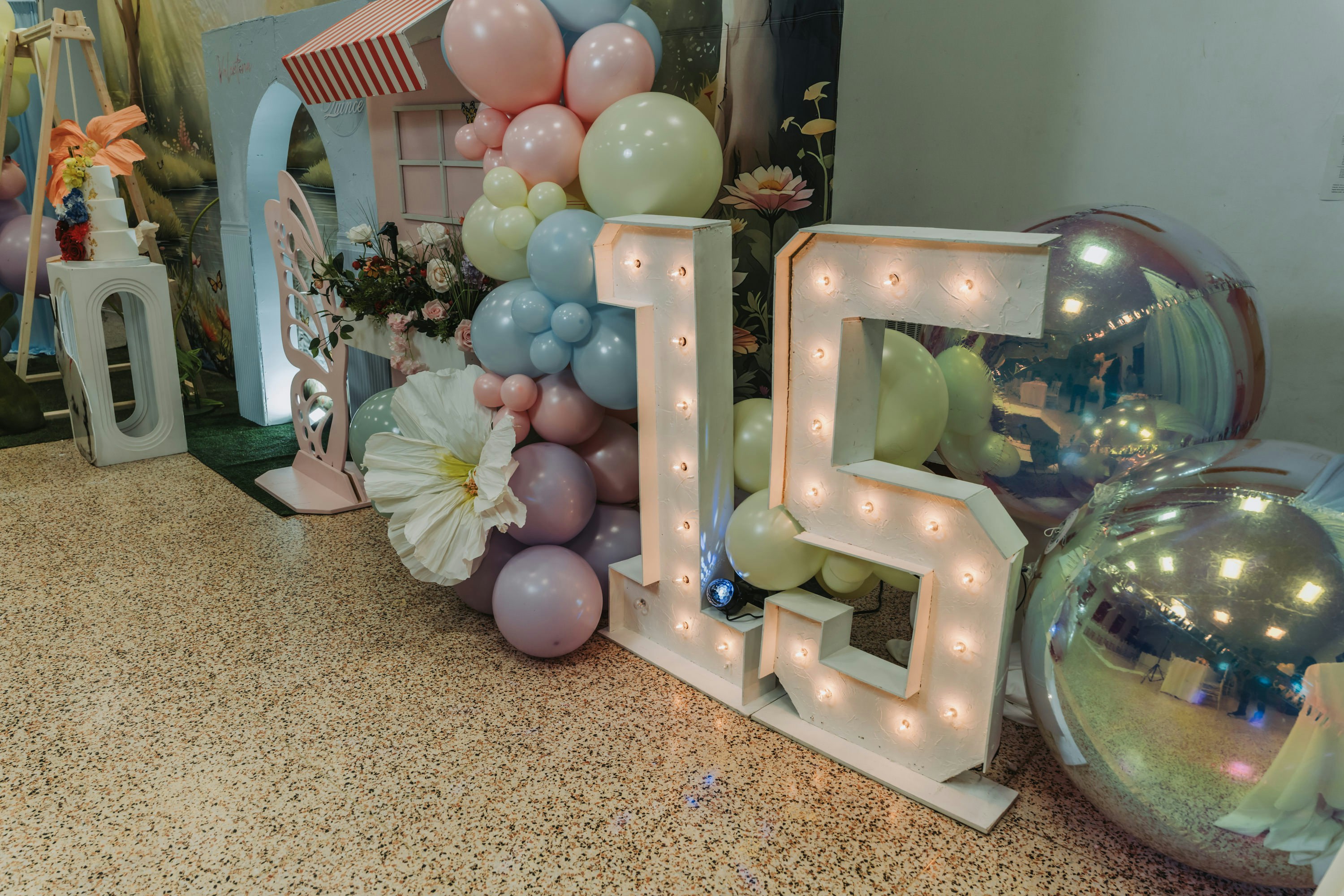 Illuminated number 15 decoration with balloons