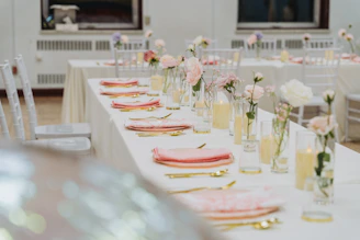 A long dining table set for an event