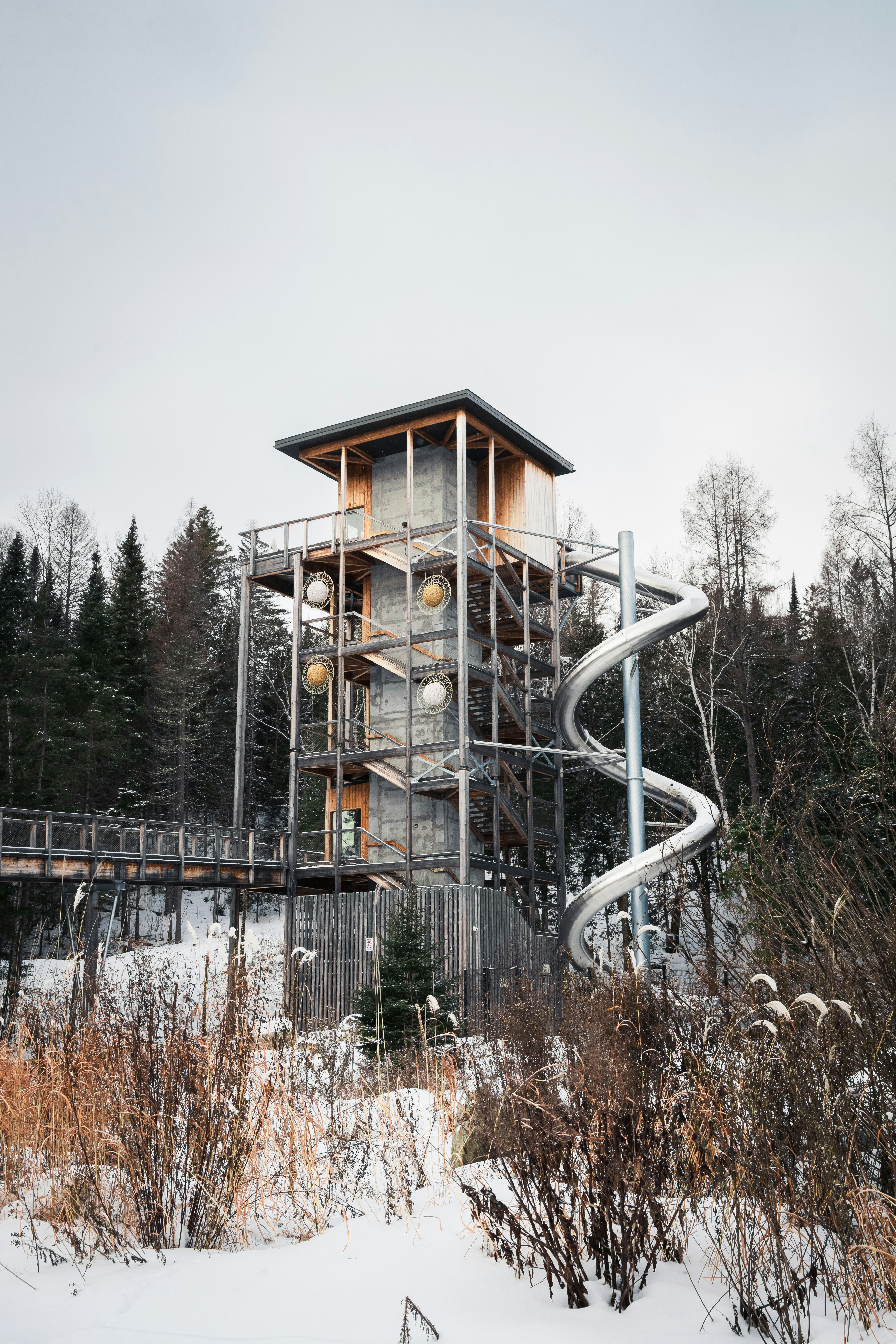 Modern observation tower with spiral slide in winter