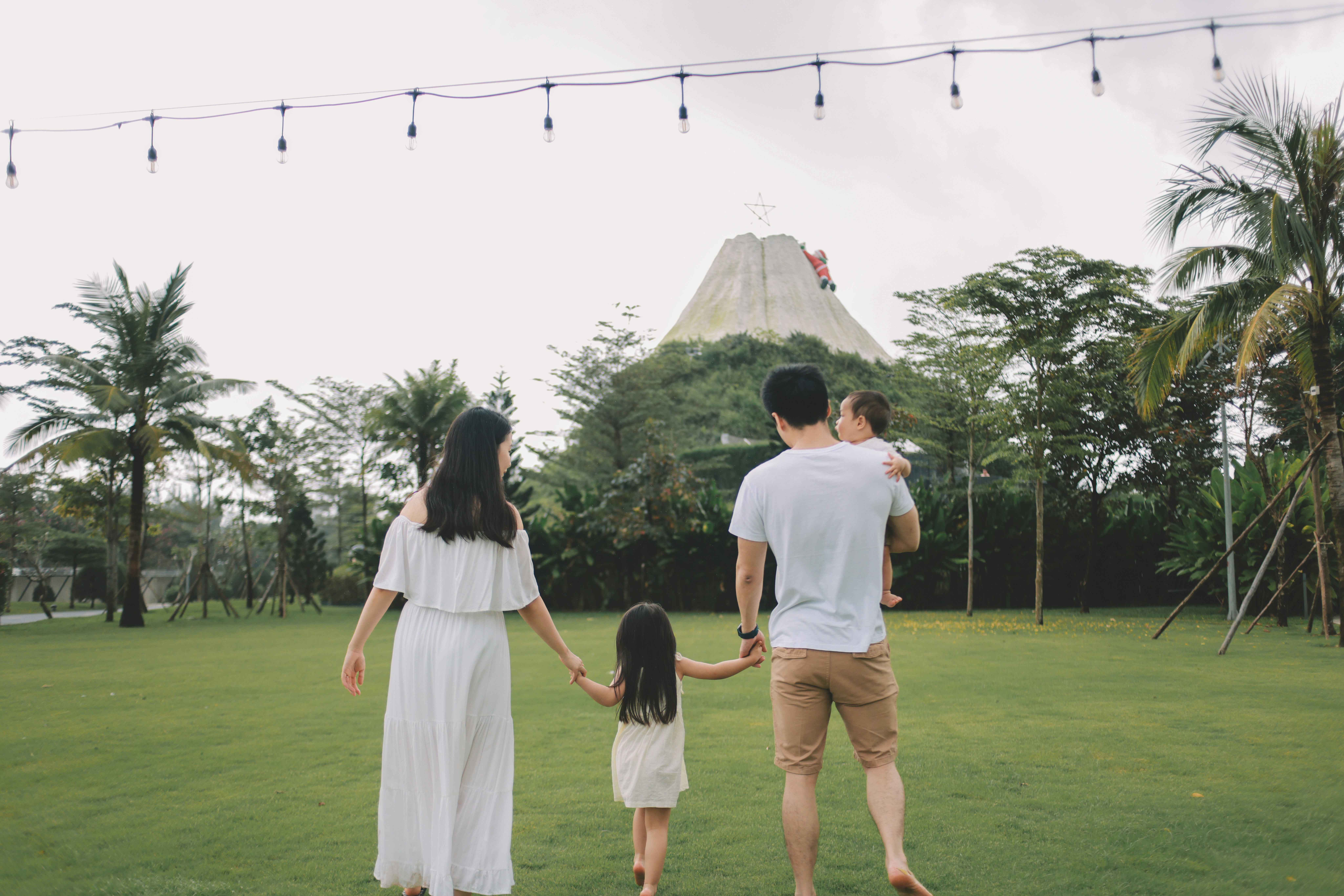 Family walks towards a volcano attraction