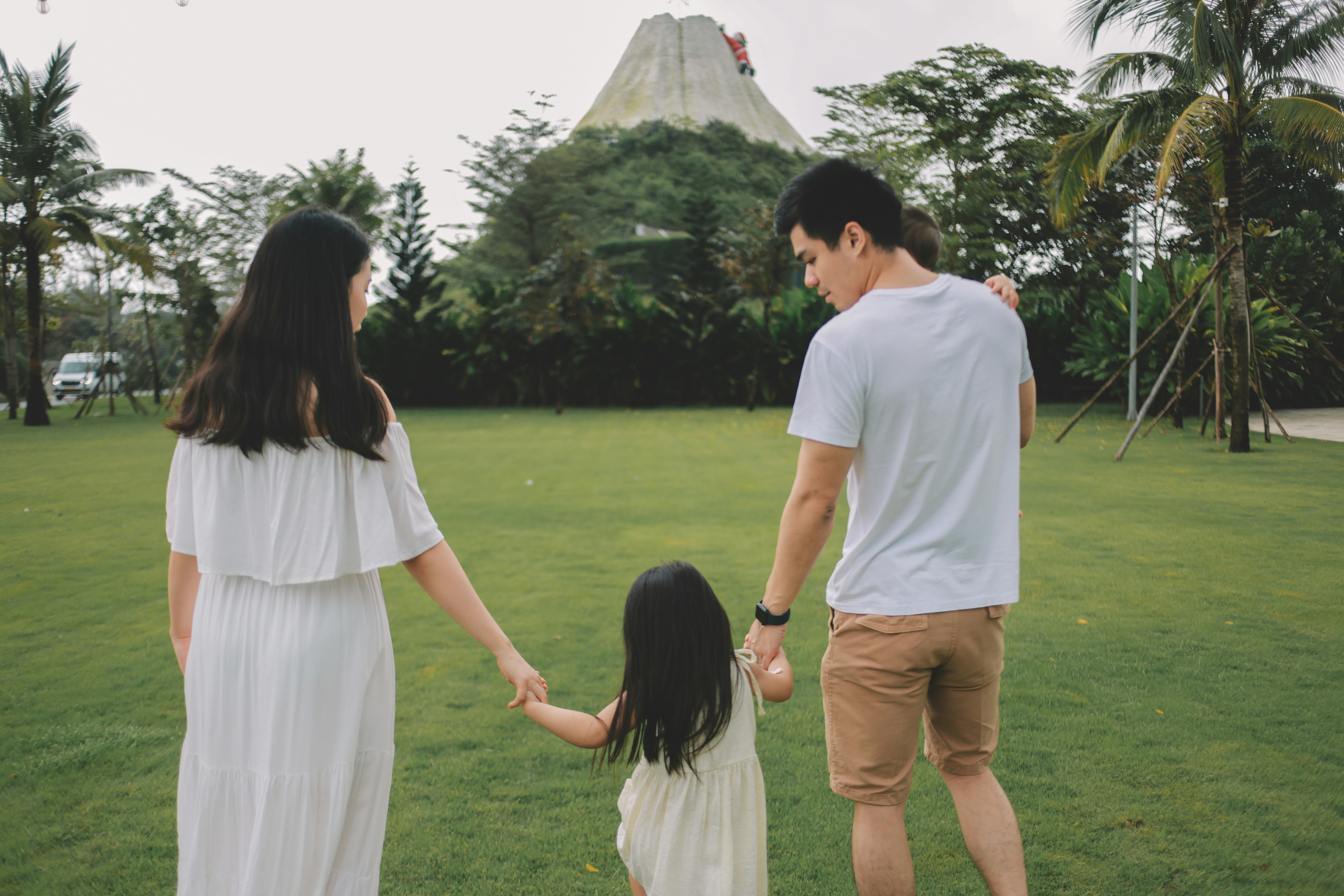 Family walking towards a volcano attraction