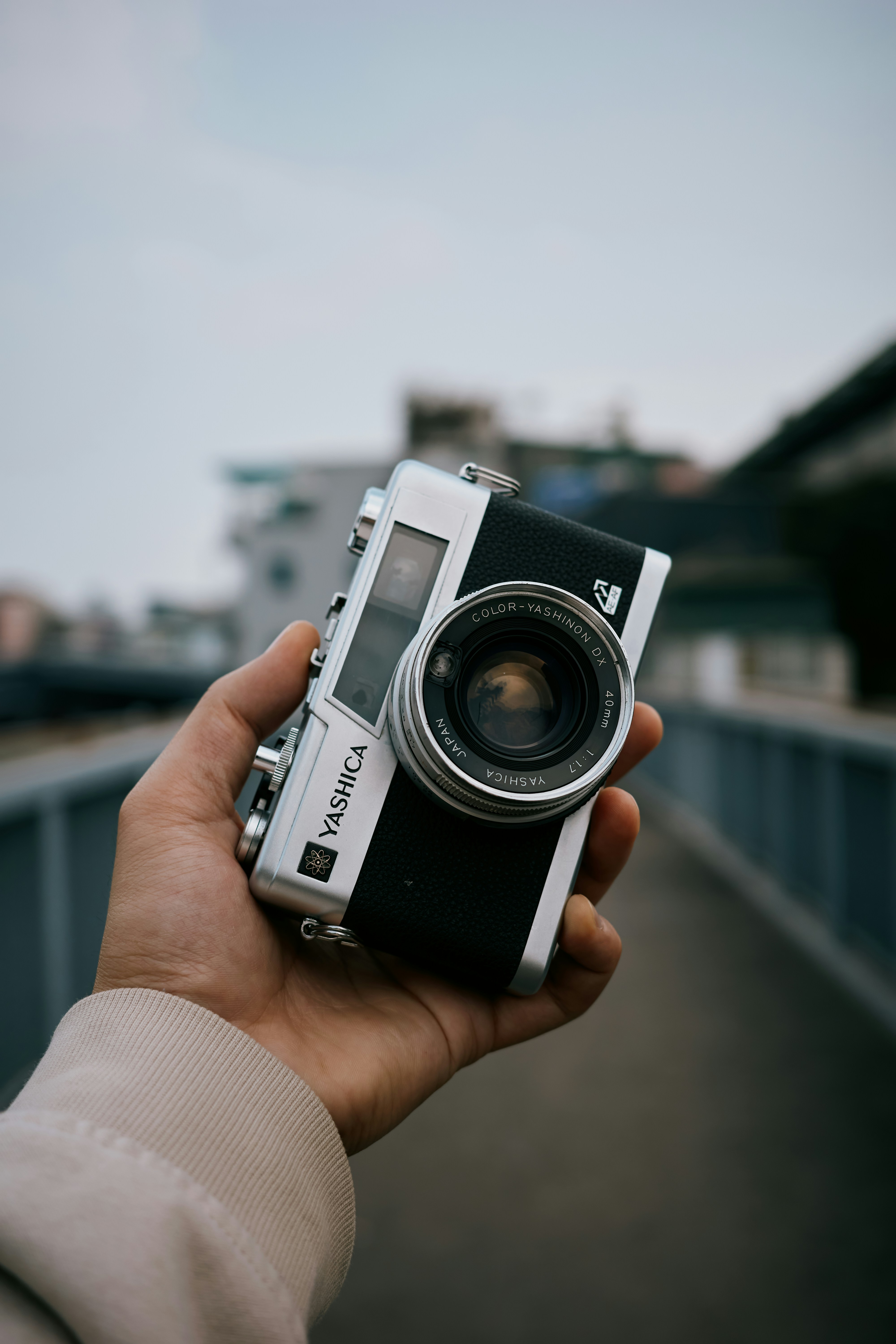 Hand holding a vintage yashica camera