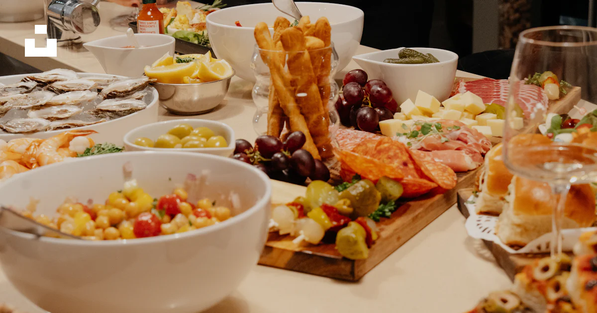 Appetizer Table Card A table filled with a variety of appetizers and snacks. photo – Free ...