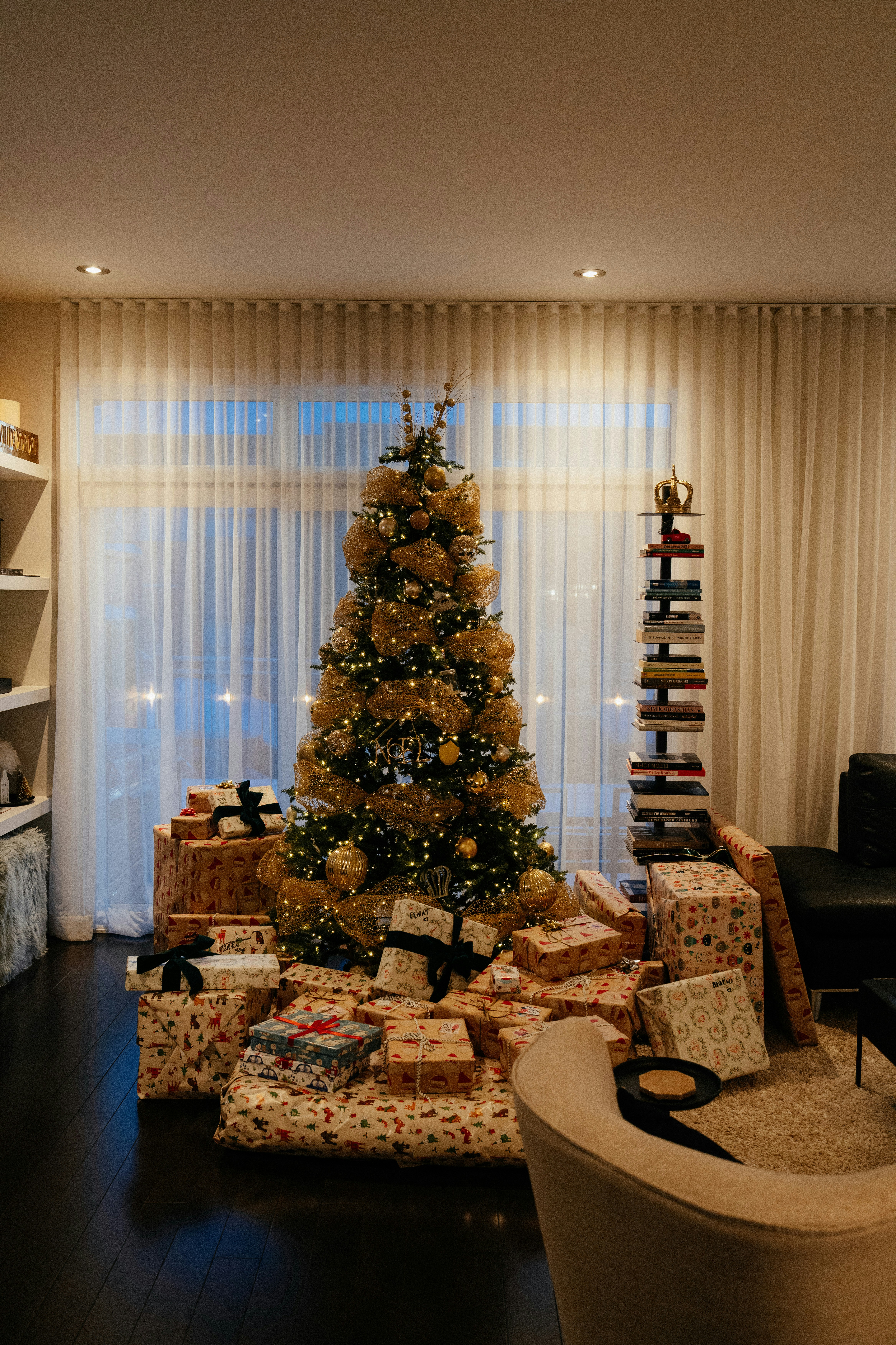 Decorated christmas tree surrounded by wrapped gifts