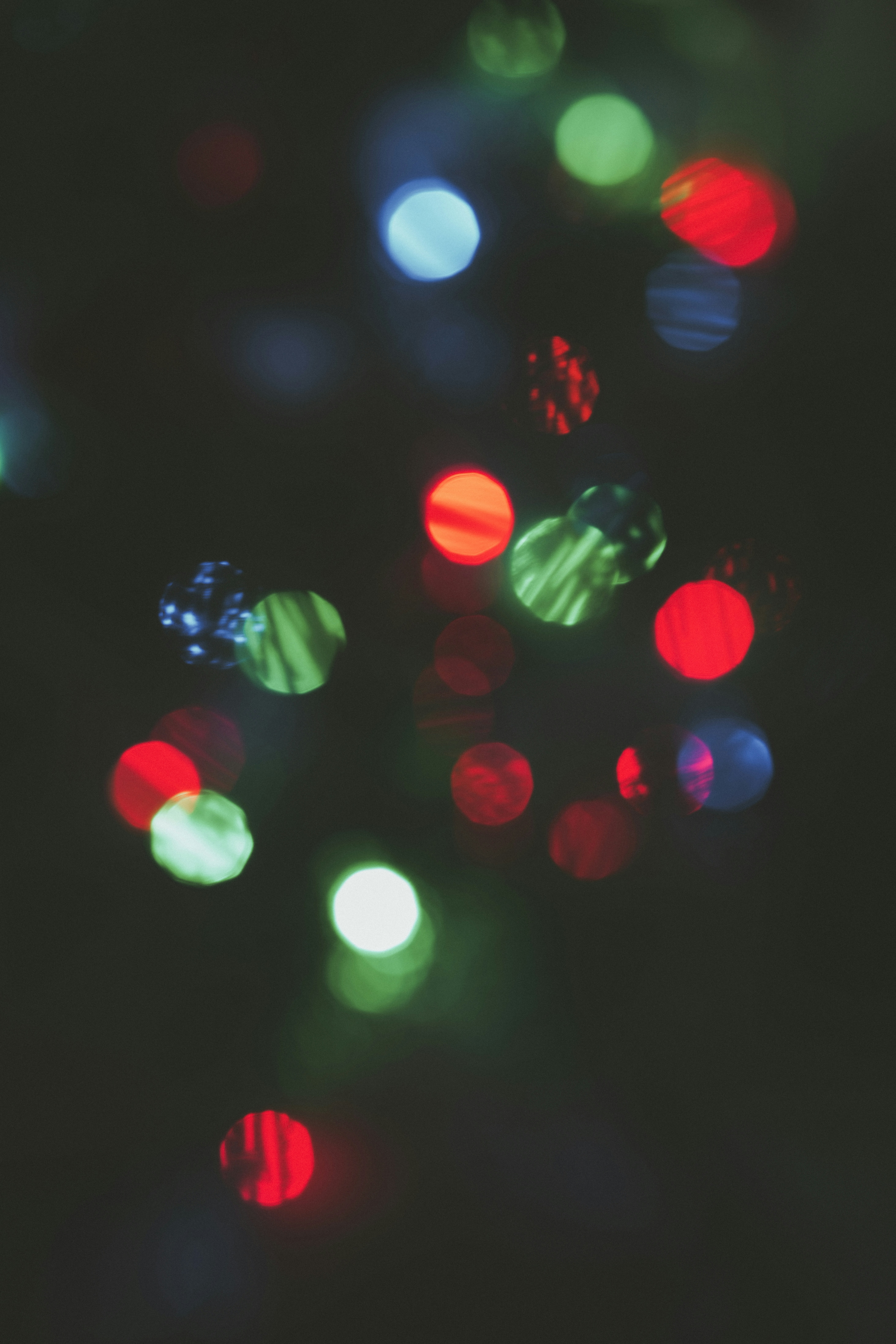 Blurred colorful bokeh lights on dark background